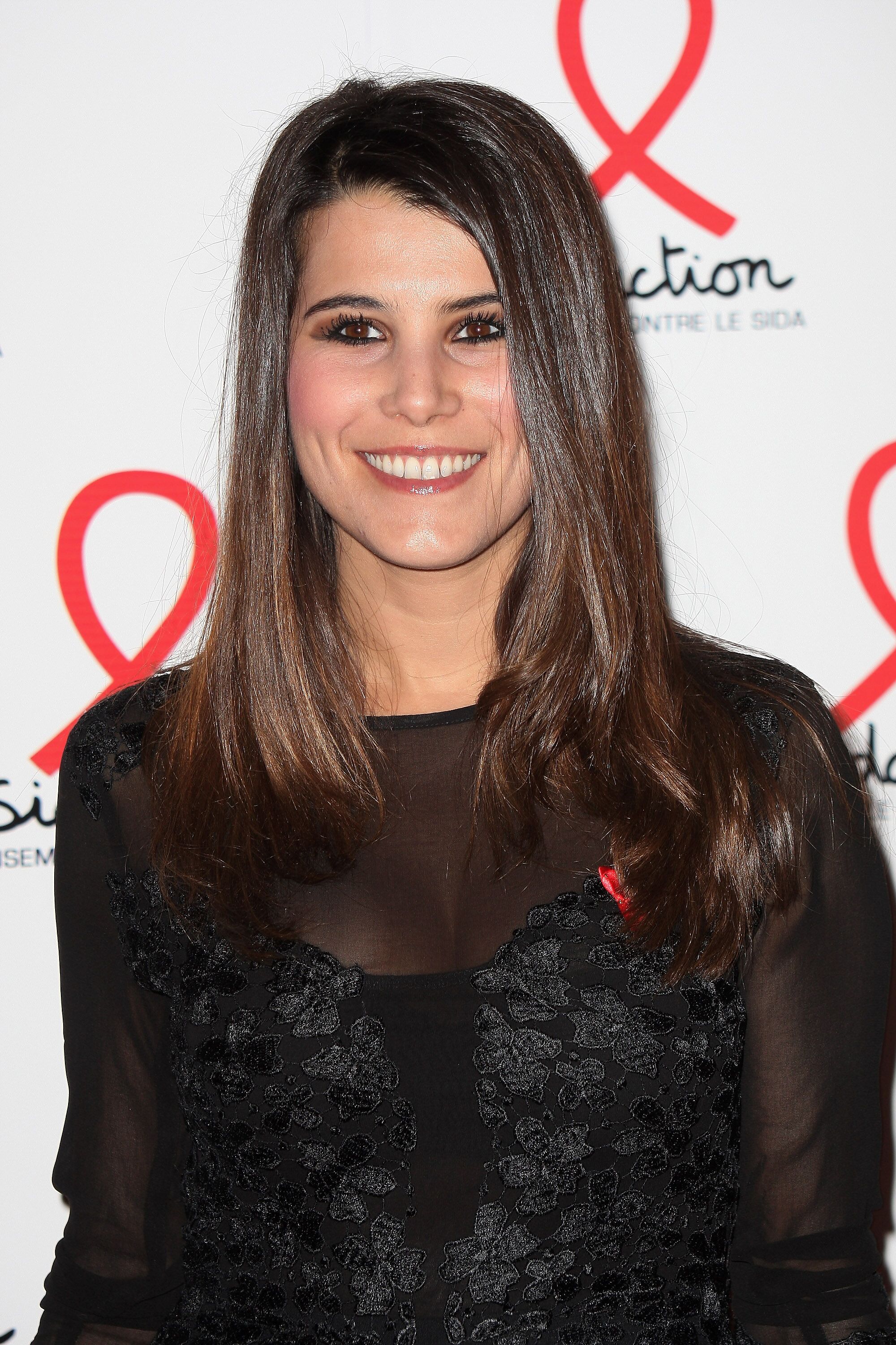 Karine Ferri pose lors du Sidaction 2013.| Photo : GettyImage