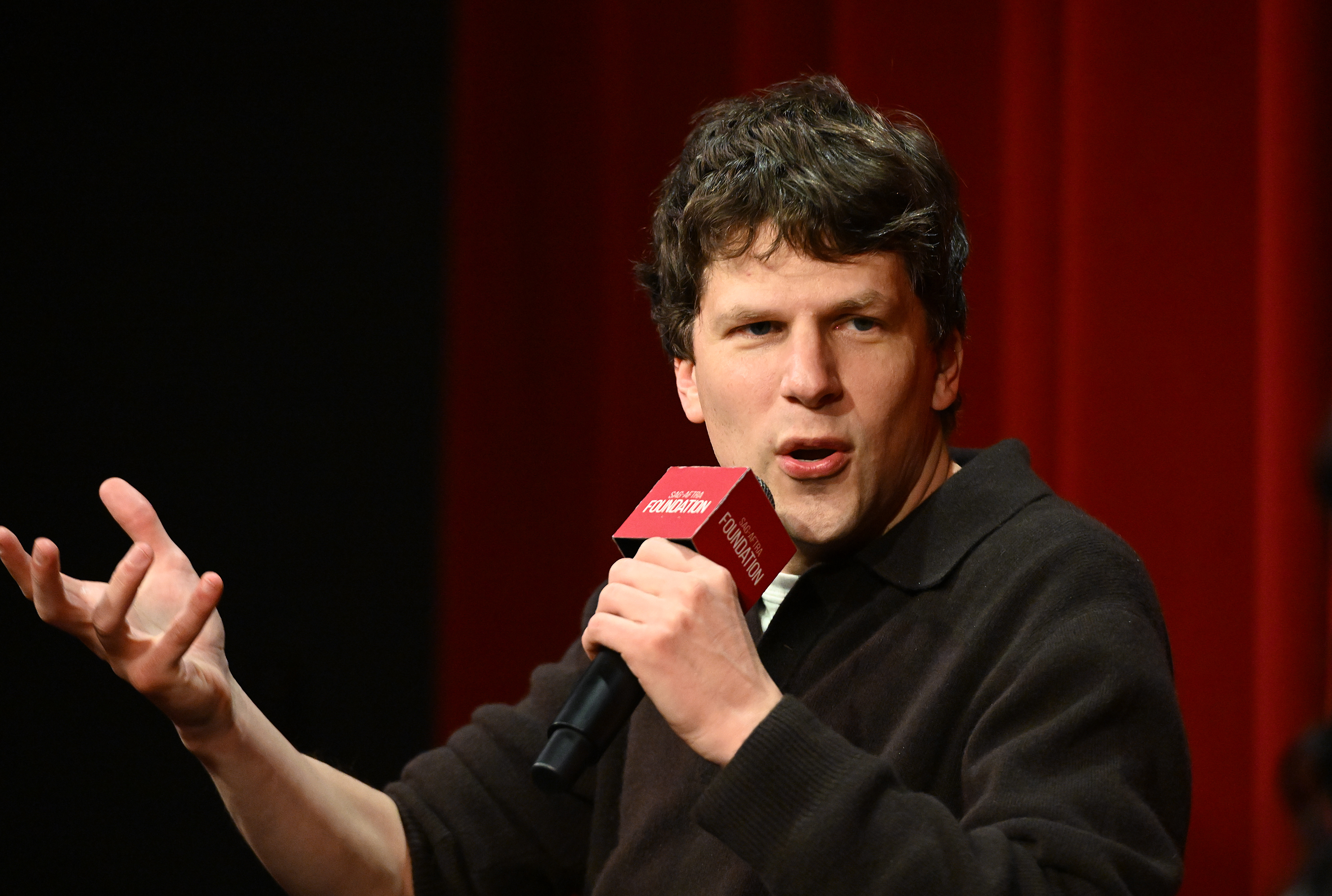 Jesse Eisenberg speaking during a screening and Q&A session for "A Real Pain" as part of the Conversations at the SAG-AFTRA Foundation series in Los Angeles, California on December 4, 2024. | Source: Getty Images
