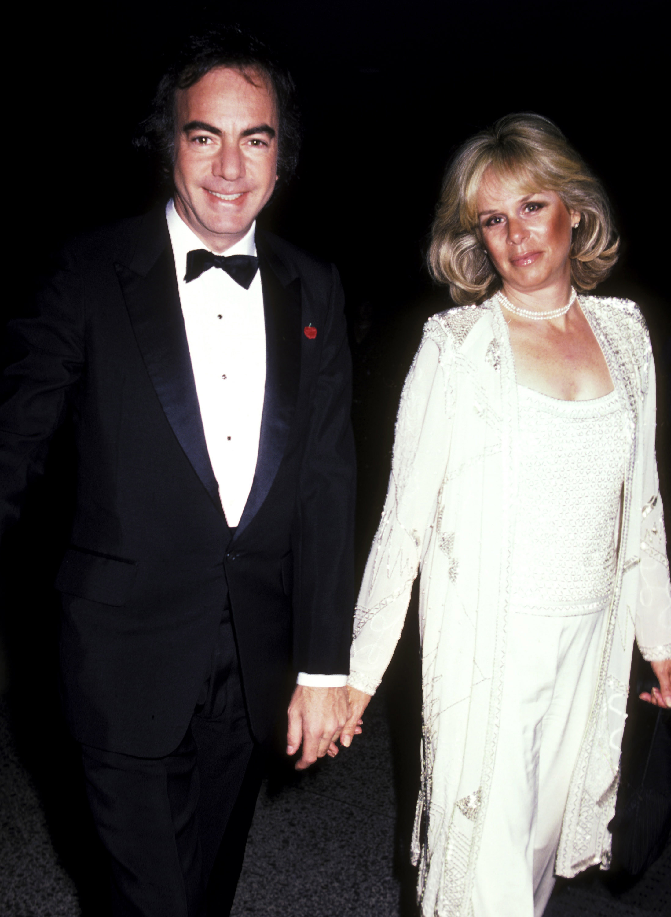 The famous '80s singer and his wife Marcia Murphey photographed at a benefit dinner in 1984. | Source: Getty Images