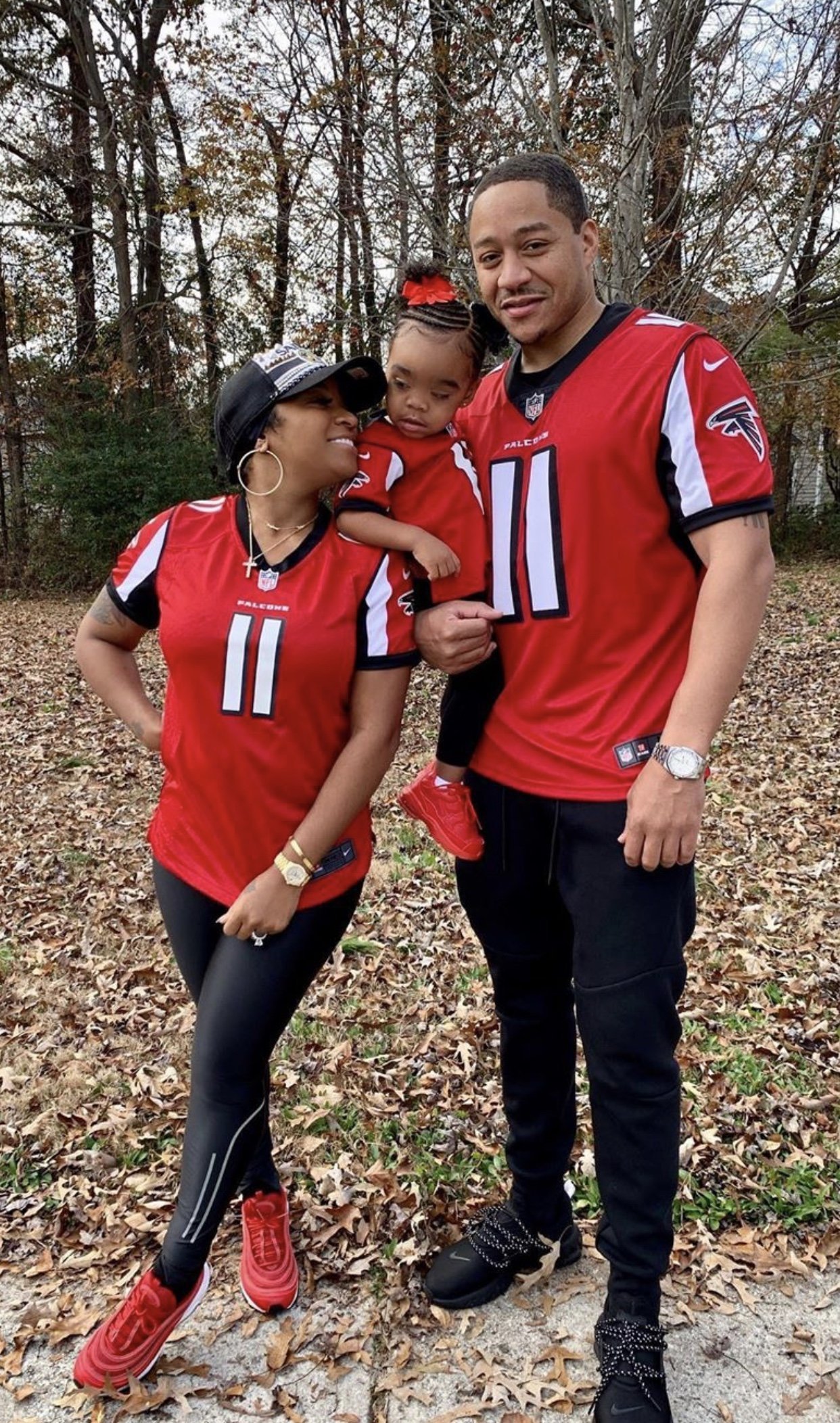 A screenshot of Toya Johnson, Robert Rushing and Reign Rushing in matching Falcons jerseys | Source: Instagram/ToyaJohnson