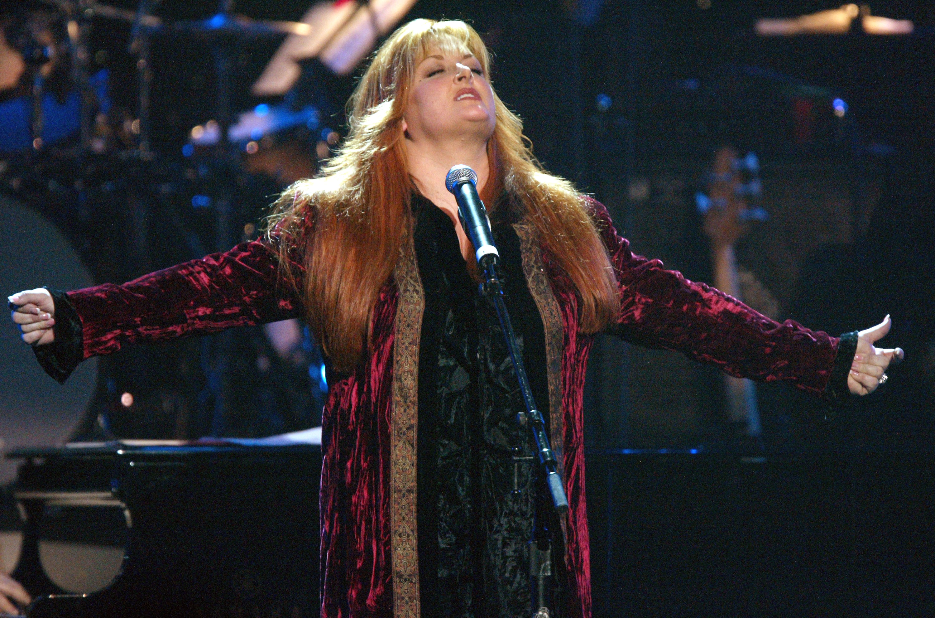 Wynonna Judd performing at the Musicares 2004 Person of the Year Tribute to Sting. | Source: Getty Images