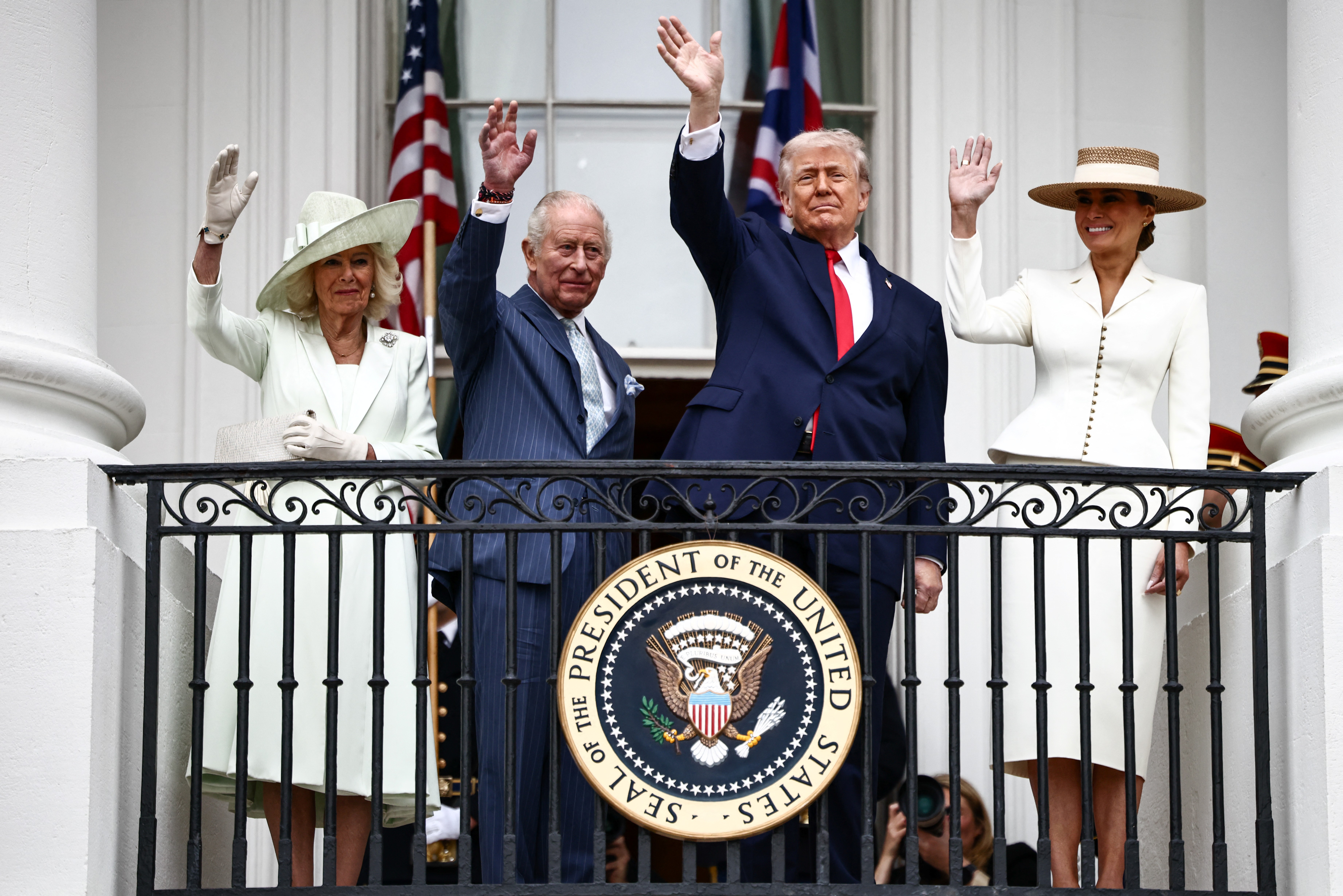 Donald Trump, Melania Trump, King Charles III, and Queen Camilla wave from the Blue Room balcony during an arrival ceremony at the White House in Washington, DC, on April 28, 2026 | Source: Getty Images