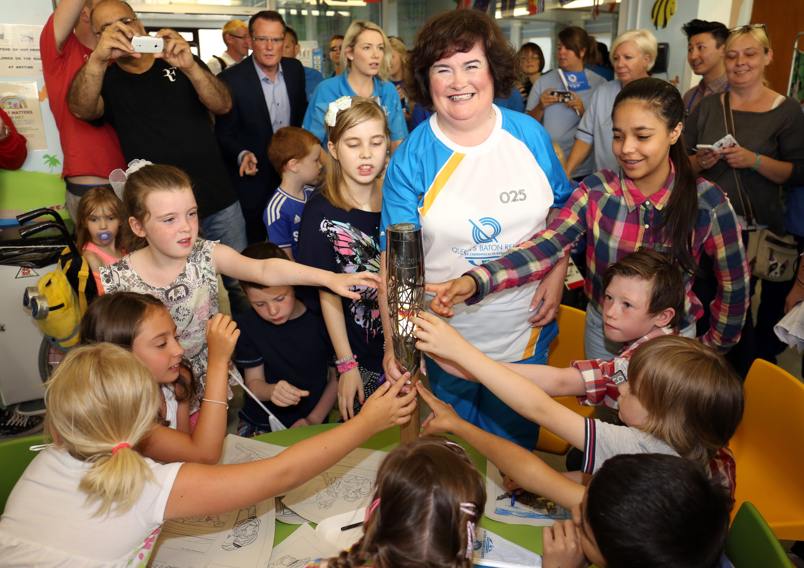 Susan Boyle carries the Glasgow 2014 Queen's Baton on July 21, 2014 in Scotland | Source: Getty Images