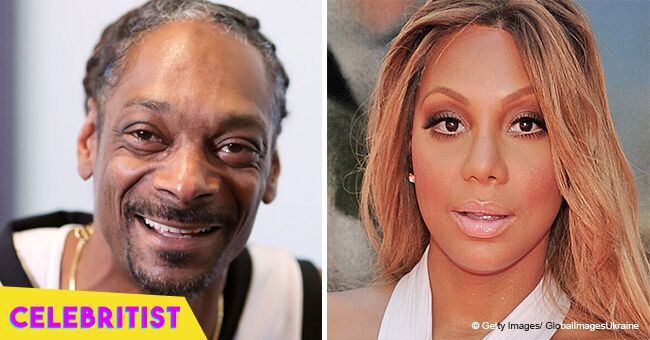 Tamar Braxton stuns in tight, white jumpsuit in recent picture with Snoop Dogg