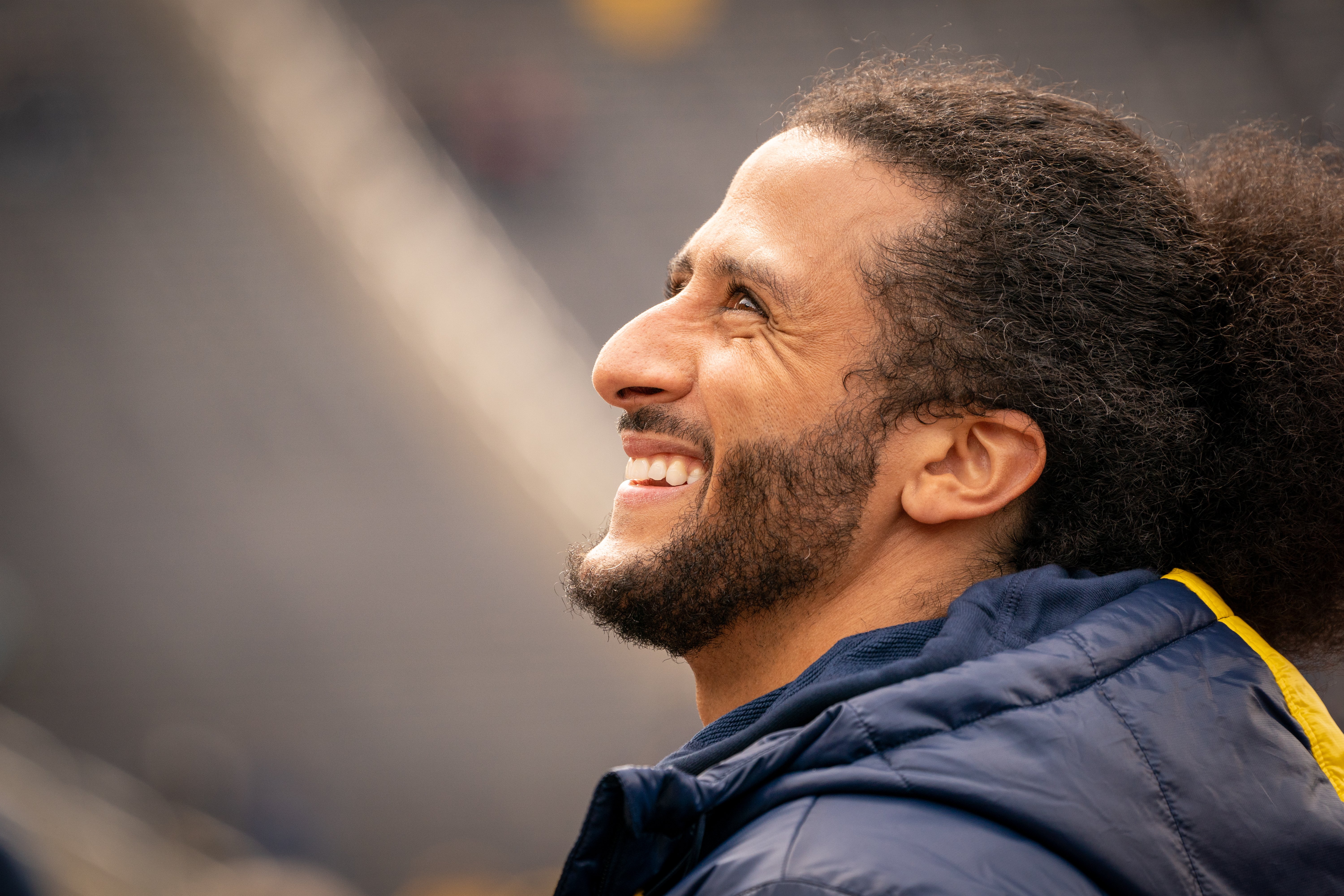 Colin Kaepernick pictured as he interacts with fans during the Michigan spring football game at Michigan Stadium in Ann Arbor | Source: Getty Images