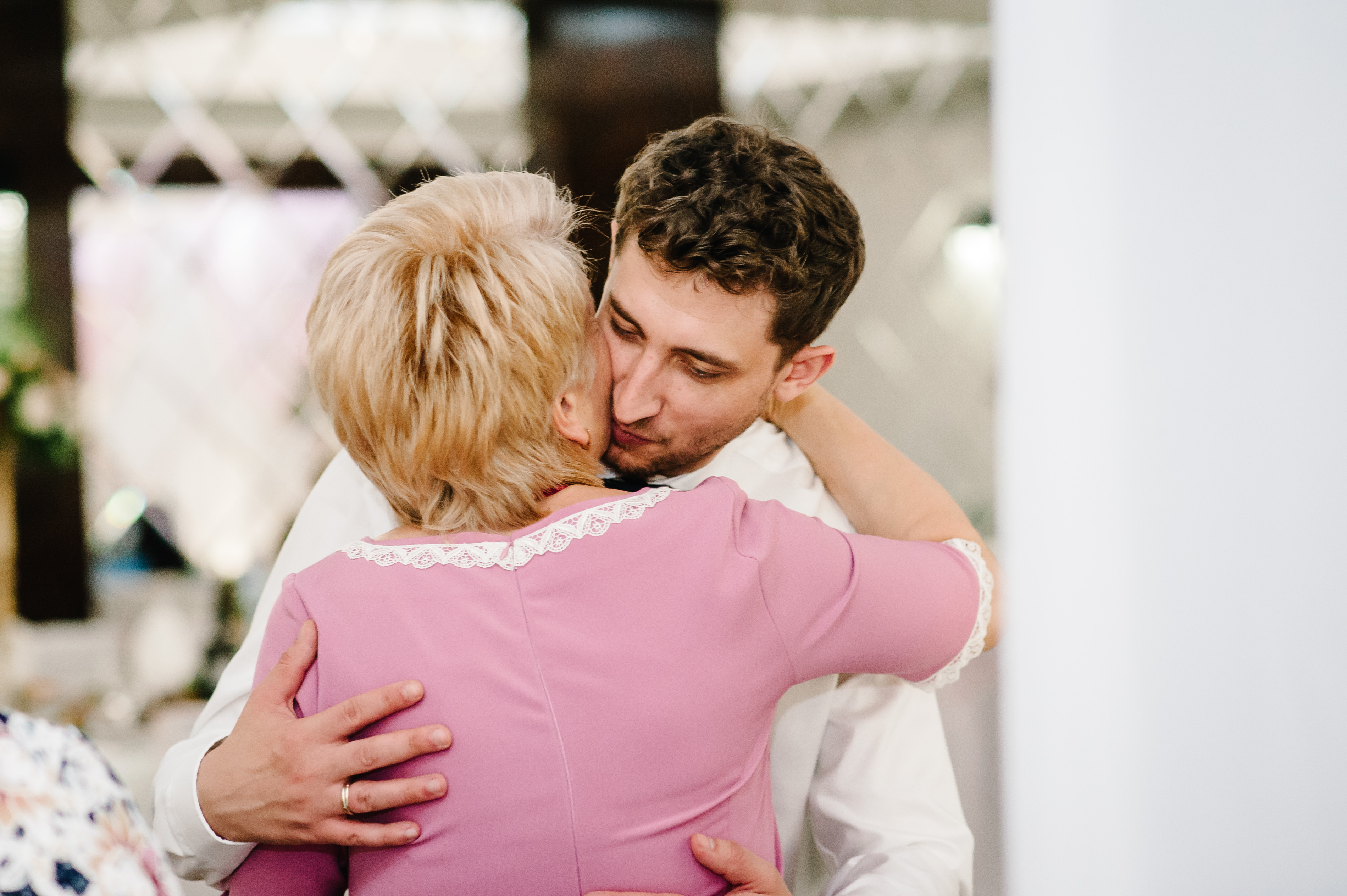 A man kissing his mother on the cheek | Source: Shutterstock