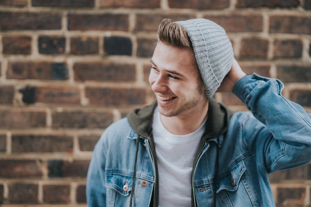 A young man smiling |  Source: Unsplash