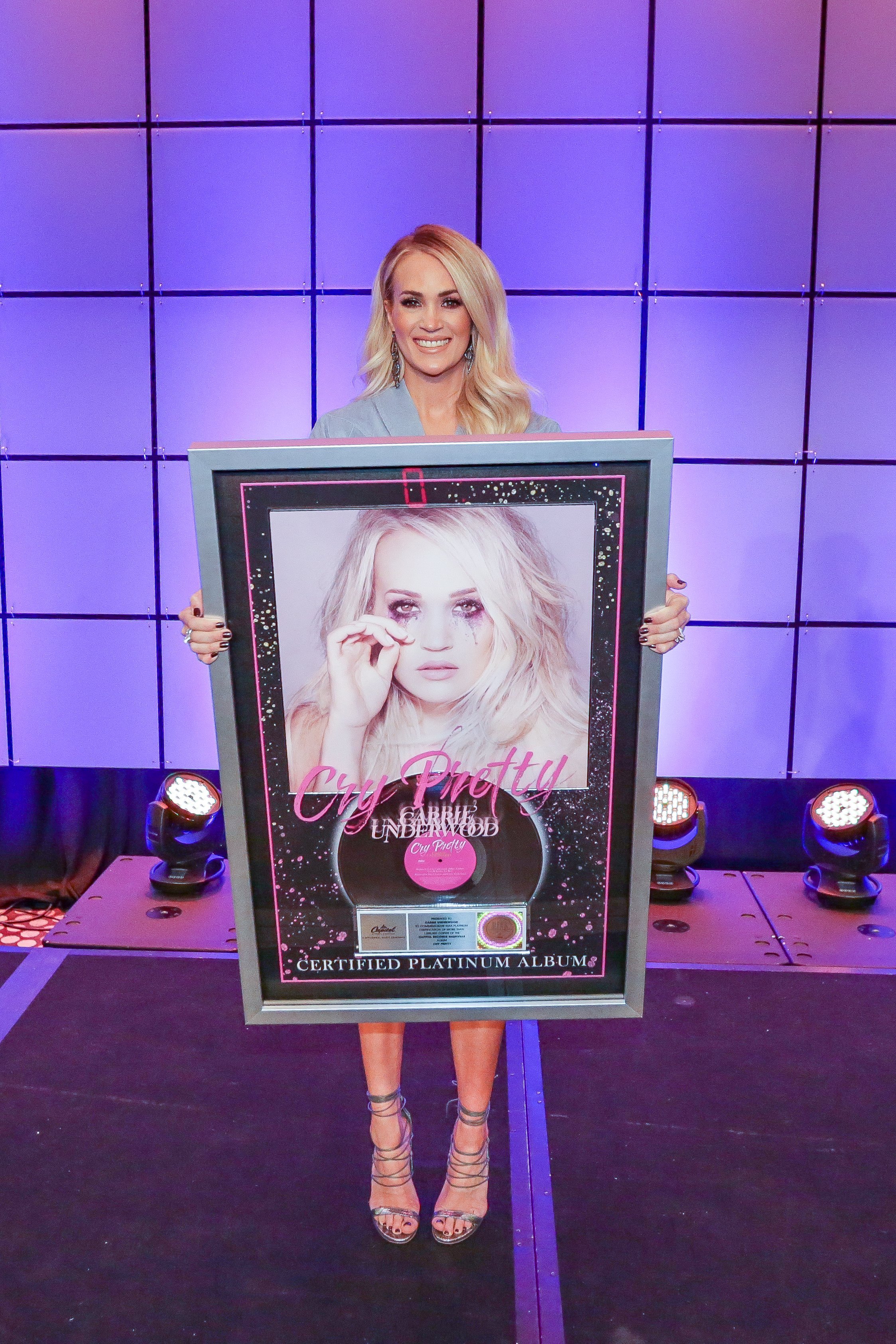 Carrie Underwood with her RIAA Platinum certification for her latest album Cry Pretty in February 2020. | Source: Country Radio Seminar 2020/Kayla Schoen.