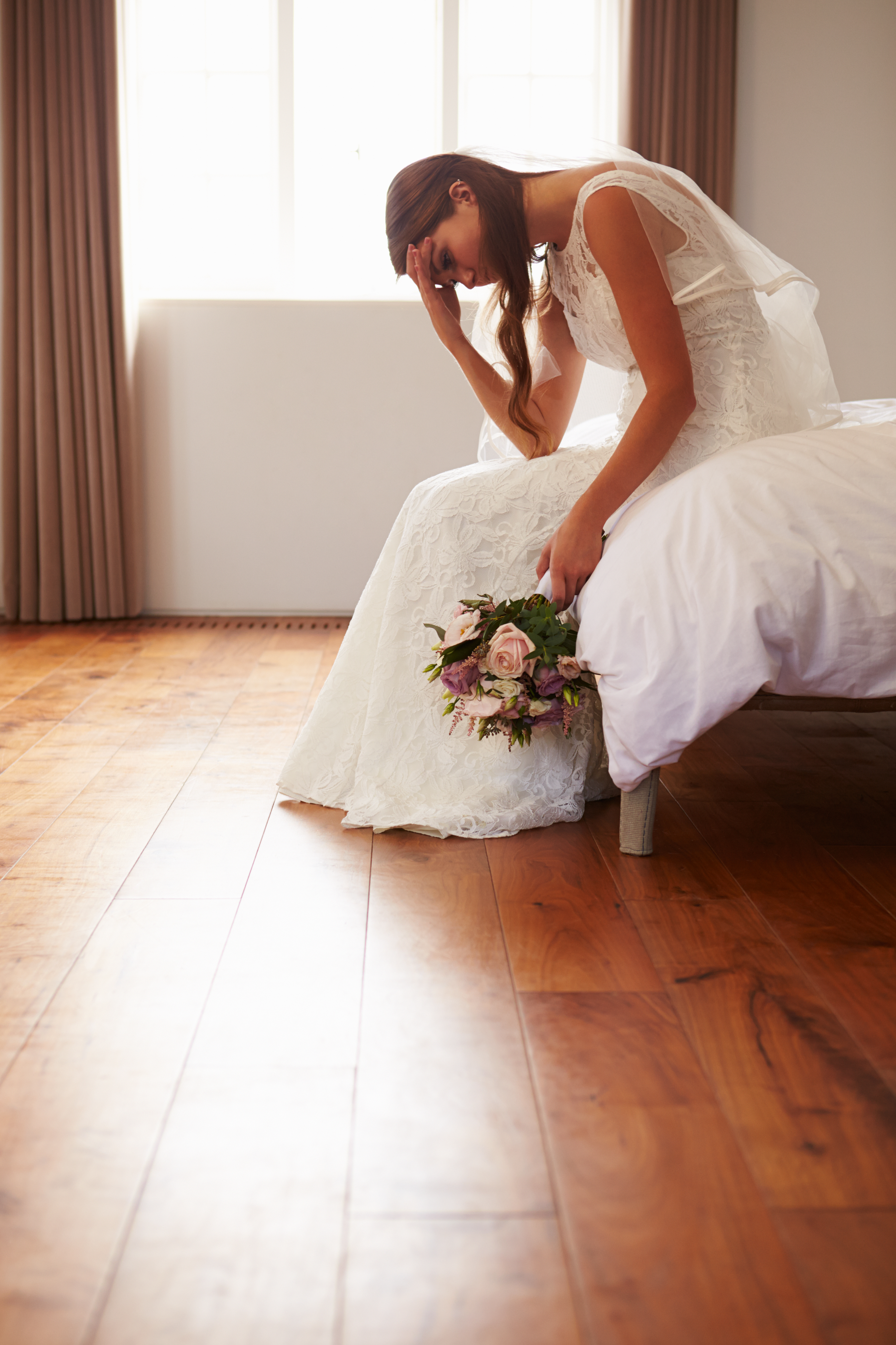 A distressed bride in the bedroom | Source: Shutterstock