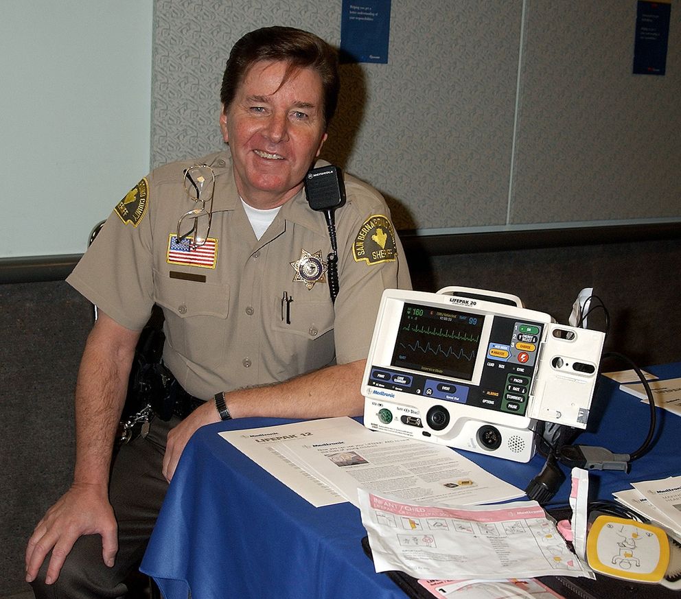 Musician-turned-EMT Bobby Sherman posing next to a defibrillator | Source: Getty Images