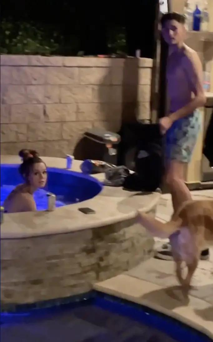Austin's girlfriend with another guy in his backyard, as seen in a video dated February 24, 2021 | Source: TikTok/@snow5_0