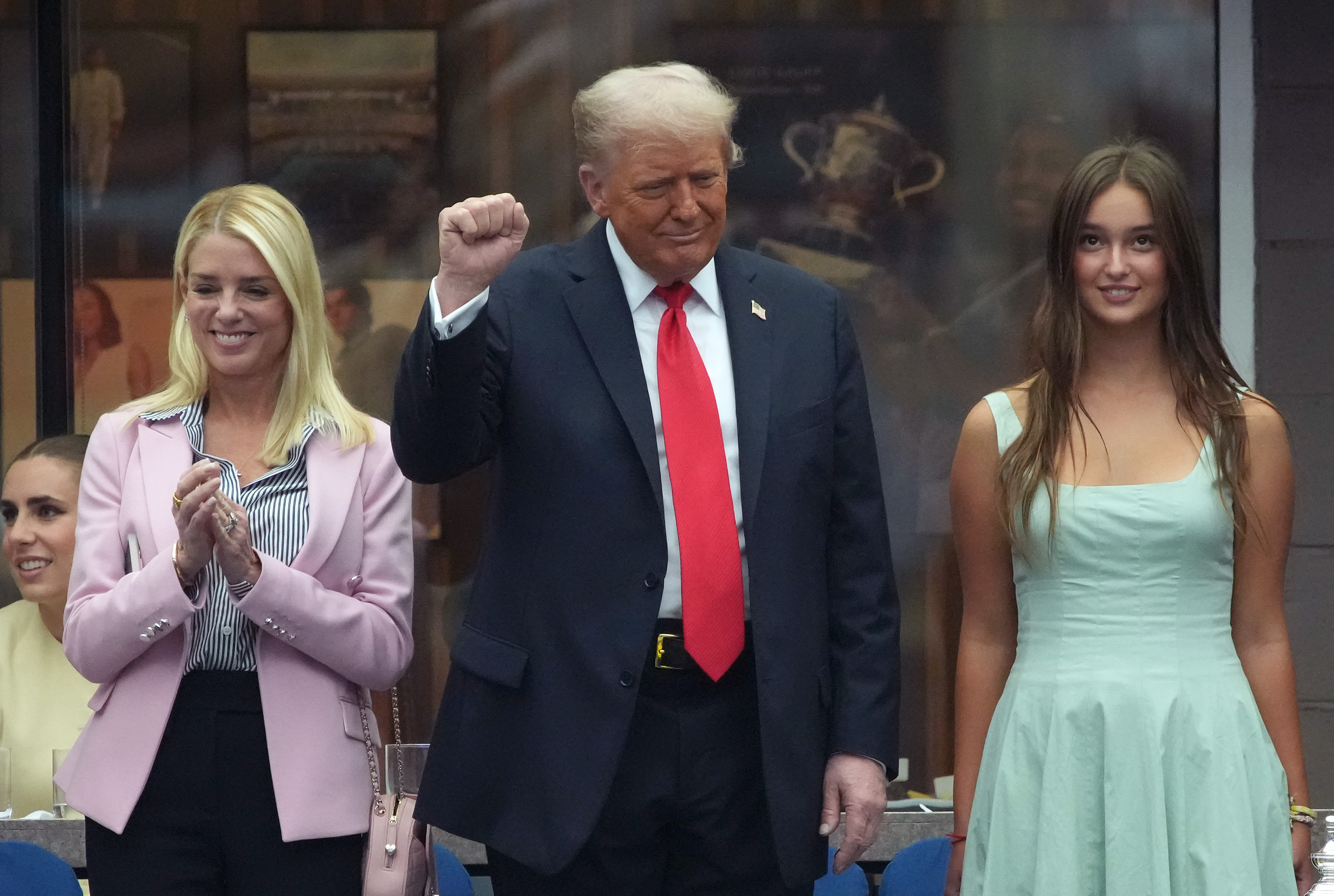 President Donald Trump (C), U.S. Attorney General Pam Bondi (L), and Arabella Kushner (R) look on before the start of the U.S. Open men's singles final at the Billie Jean King National Tennis Center in New York City  on September 7, 2025 | Source: Getty Images