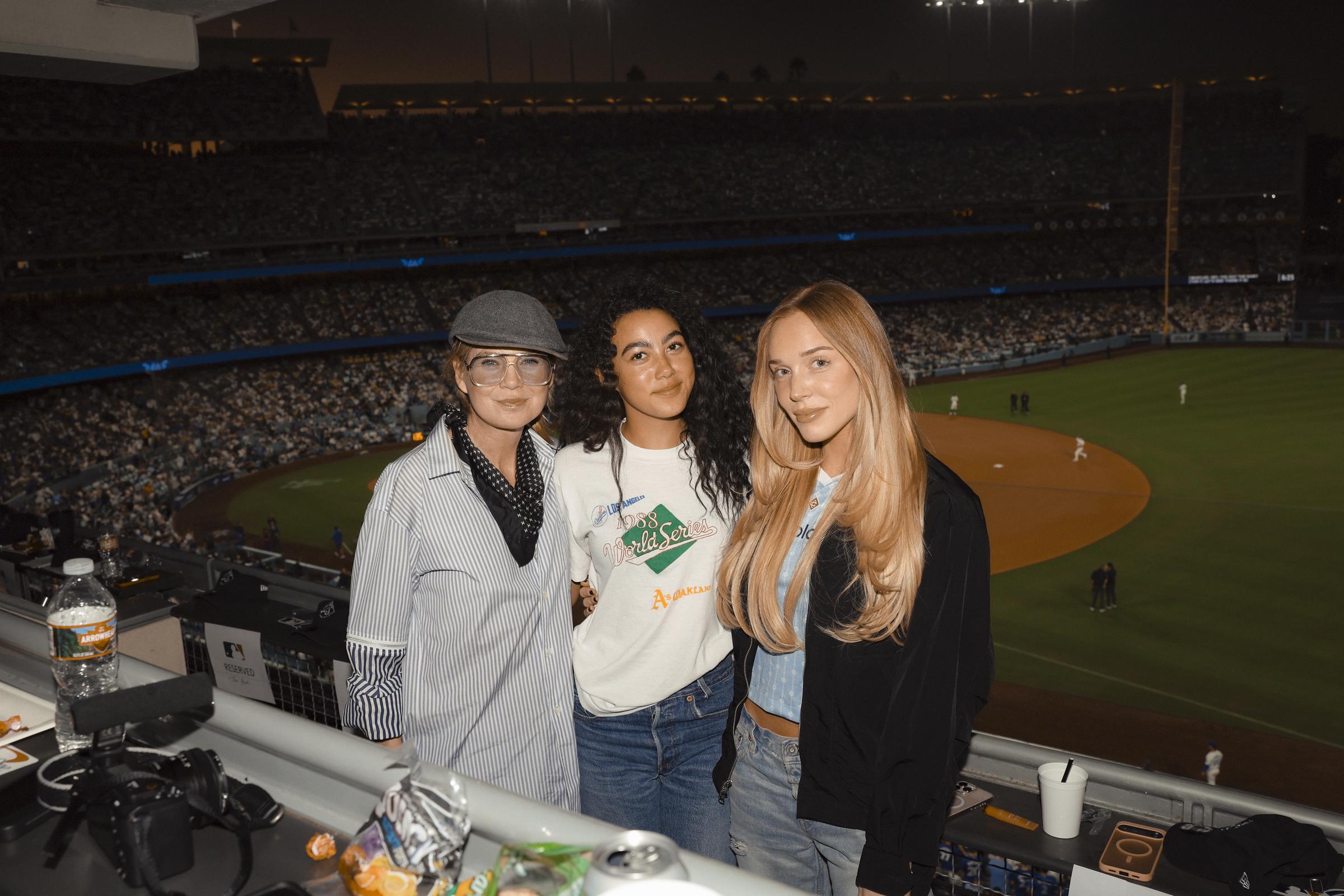 Ellen Pompeo, Stella, and Alex Cooper pose for a photo in the suite during Game Five of the 2025 World Series between the Toronto Blue Jays and the Los Angeles Dodgers in Los Angeles, California | Source: Getty Images