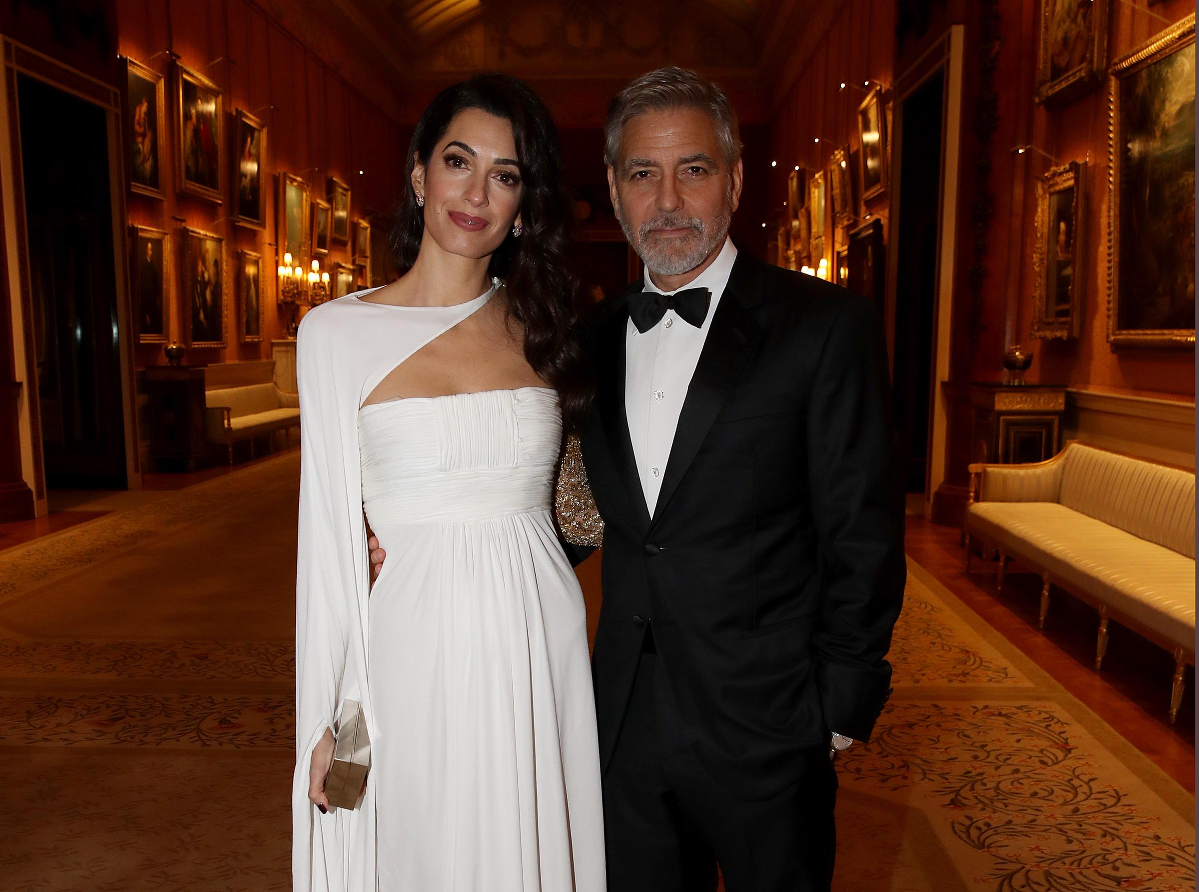 Amal and George Clooney attend a dinner to celebrate The Prince's Trust, hosted by Prince Charles, Prince of Wales at Buckingham Palace on March 12, 2019 in London, England | Source: Getty Images