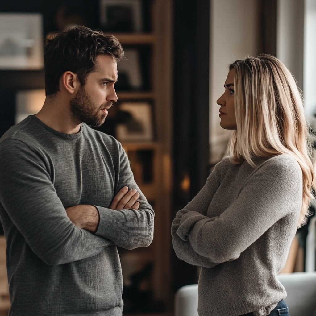 Man and woman talking with their arms crossed over their chests | Source: Midjourney