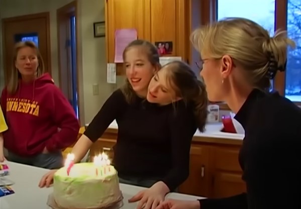 Abby and Brittany Hensel celebrate a birthday | Source: YouTube/Screen Static