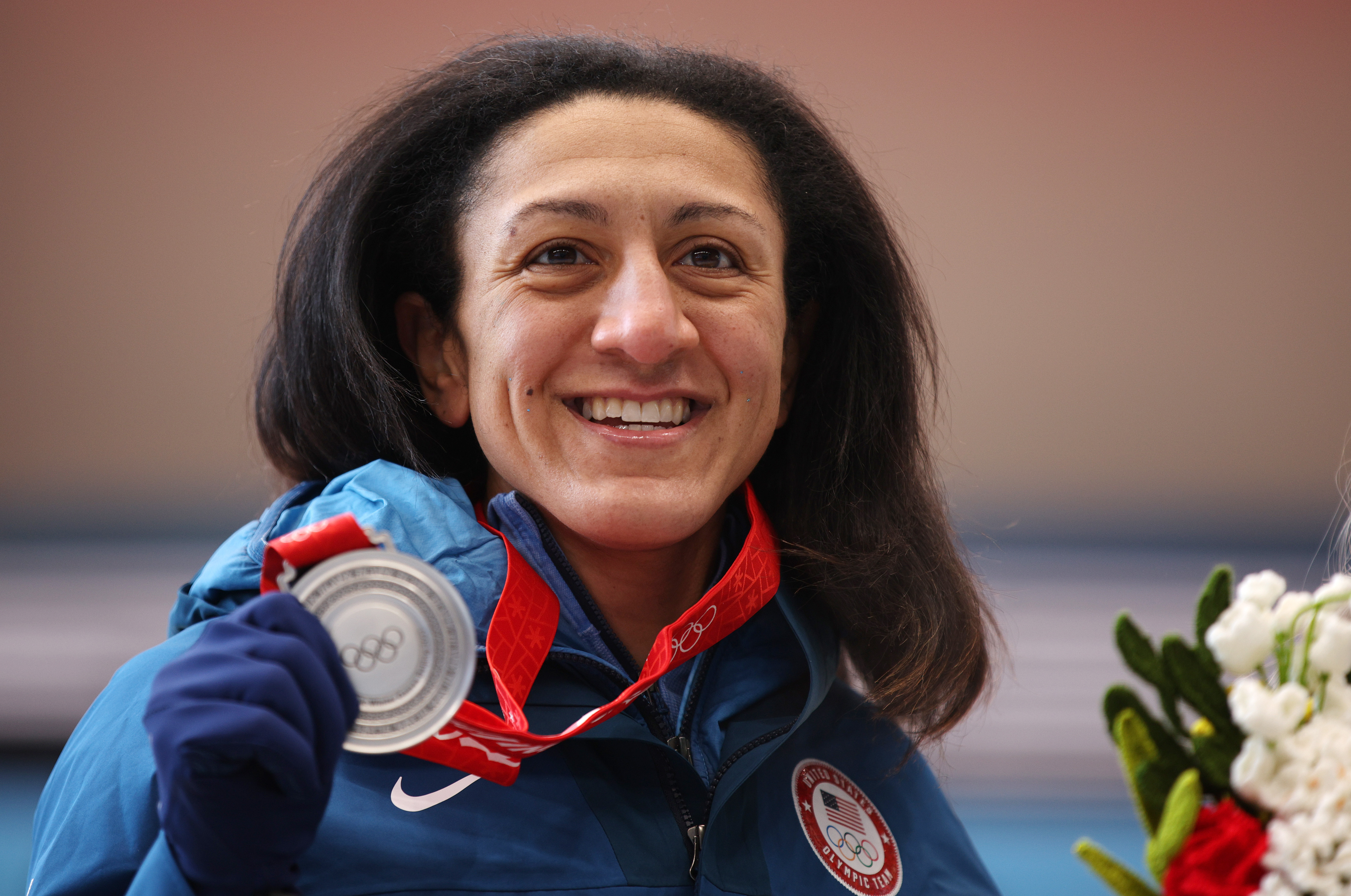Elana Meyers Taylor holds her silver medal during the women's monobob medal ceremony at the Beijing 2022 Winter Olympics in Yanqing, China | Source: Getty Images