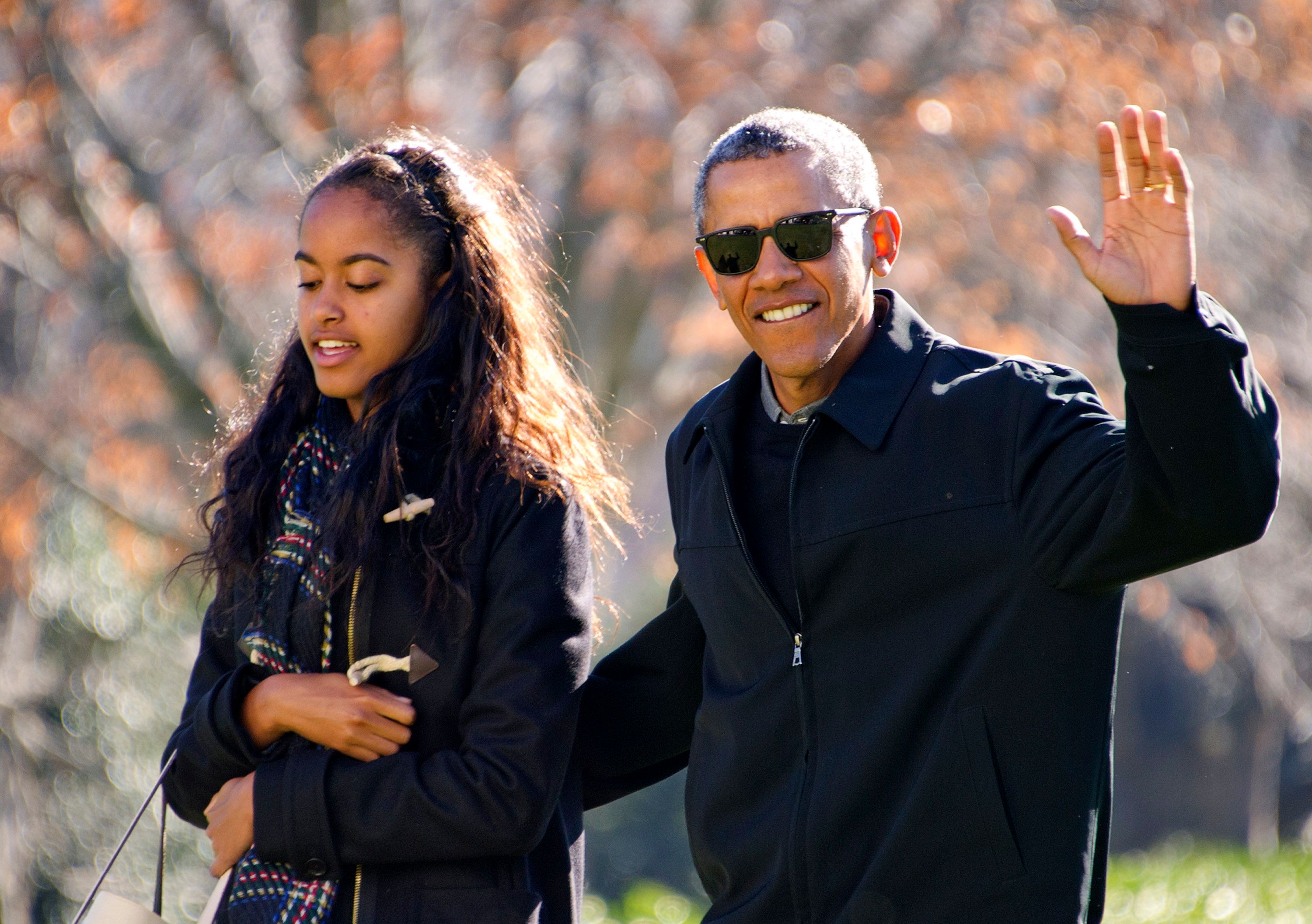 President Barack Obama walks with his daughter Malia on his family's return to the White House on January 3, 2016, in Washington, DC. | Photo: Ron Sachs-Pool/Getty Images