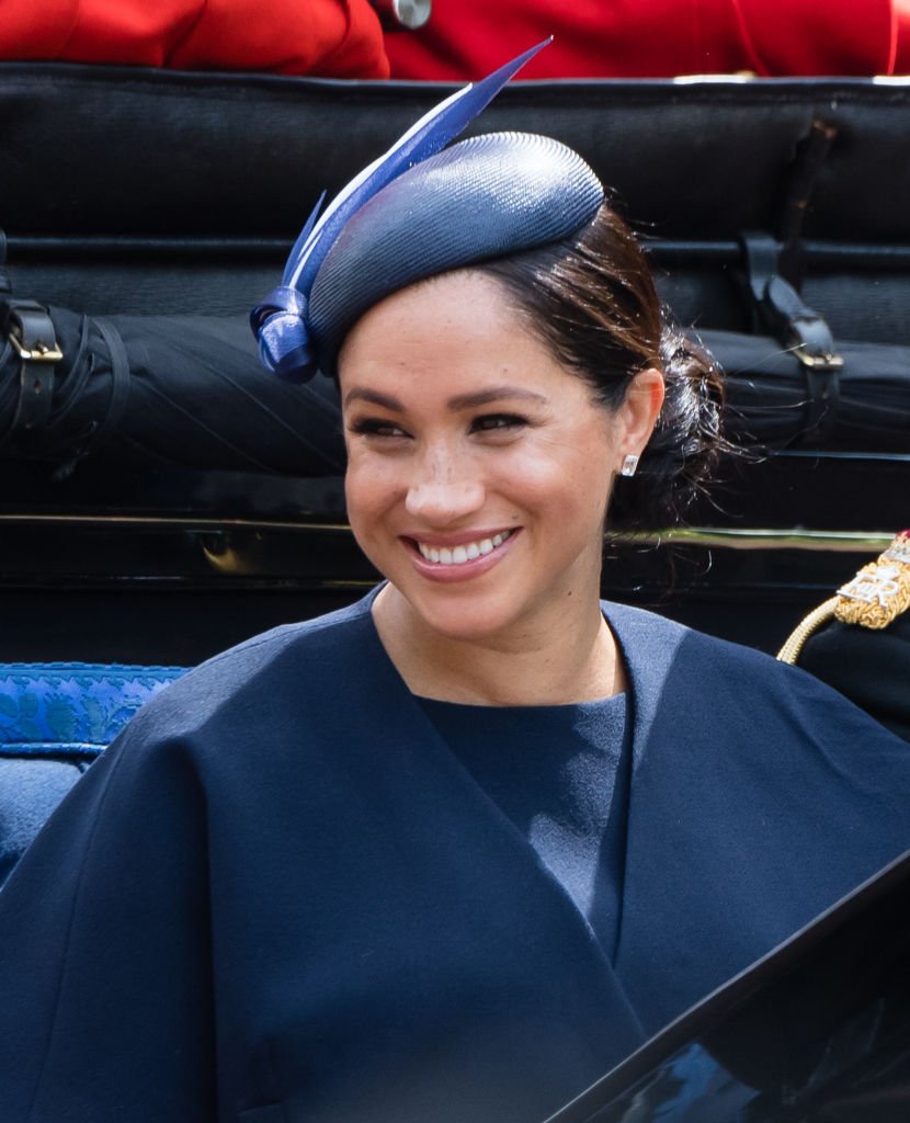 Meghan Markle pictured riding a carriage down the Mall during Trooping The Colour, the Queen's annual birthday parade, 2019, London, England. | Photo: Getty Images