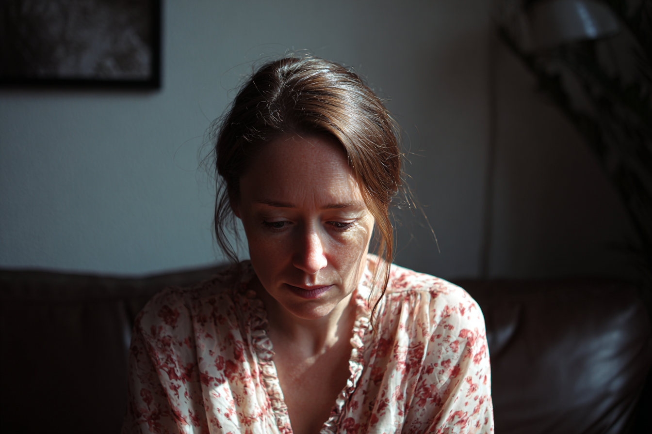 A woman sitting on a couch | Source: Midjourney