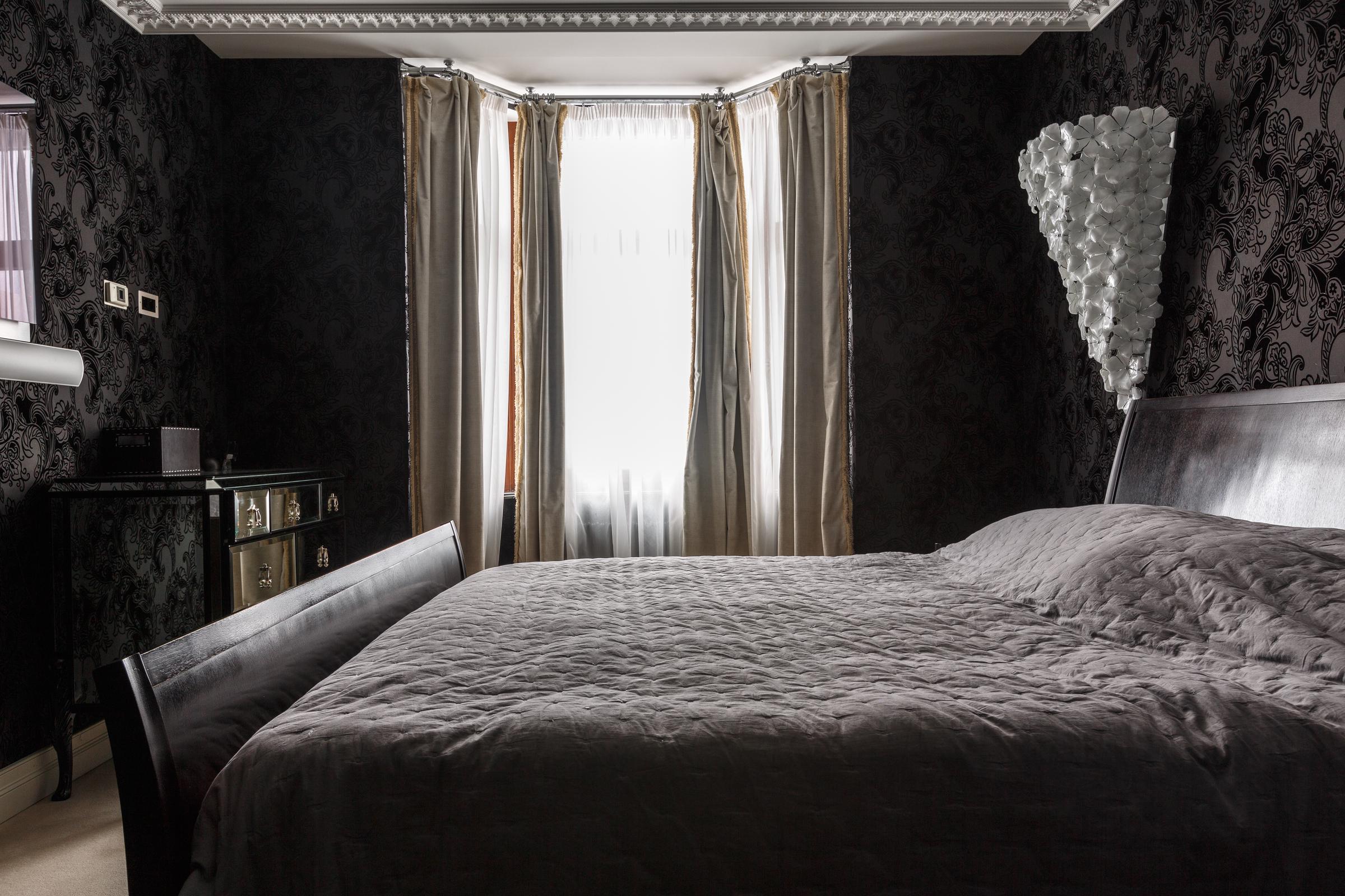 A master bedroom in dark colors | Source: Shutterstock