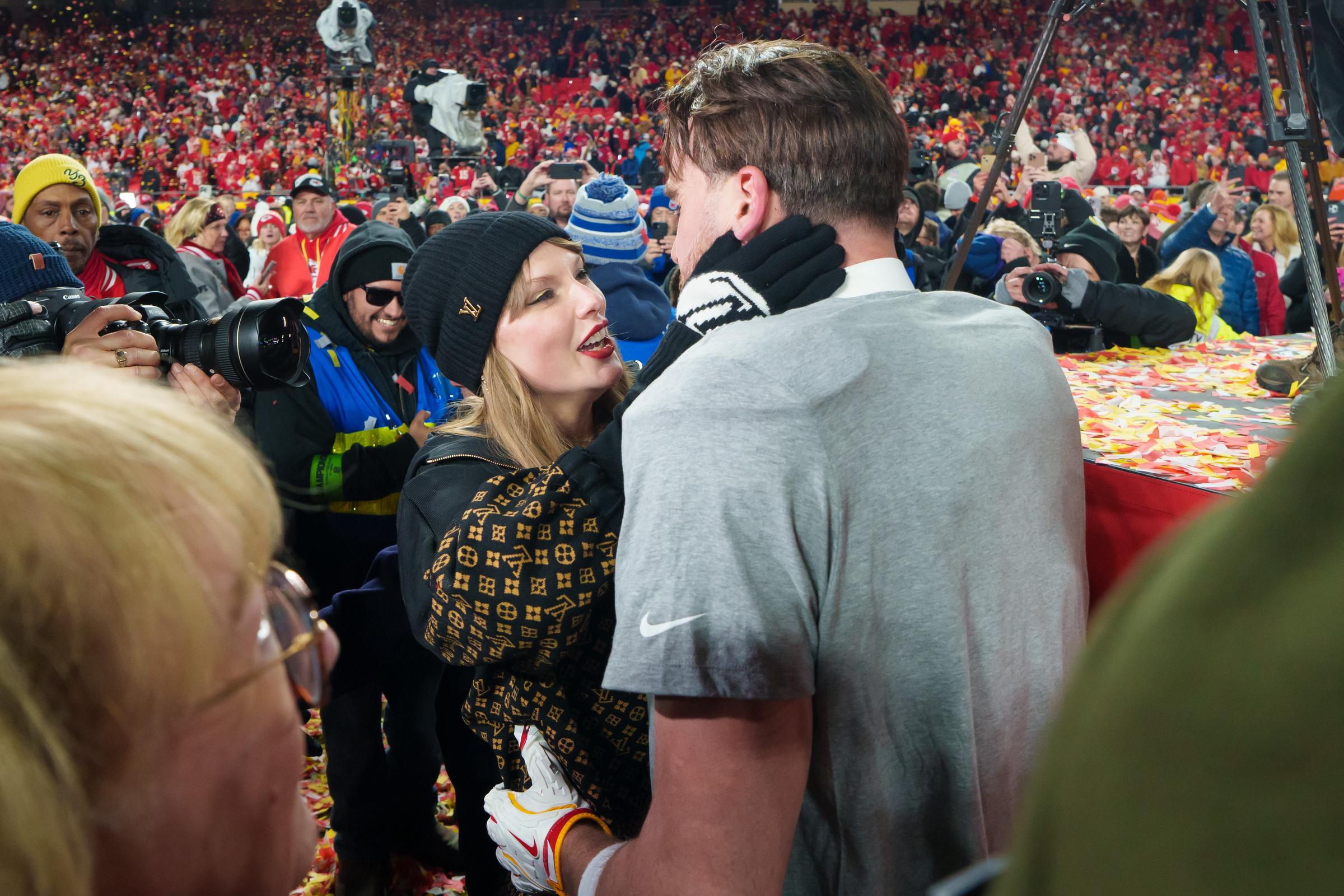 Taylor Swift embraces tight end Travis Kelce #87 of the Kansas City Chiefs following the AFC Championship NFL football game against the Buffalo Bills at GEHA Field at Arrowhead Stadium on January 26, 2025, in Kansas City, Missouri | Source: Getty Images