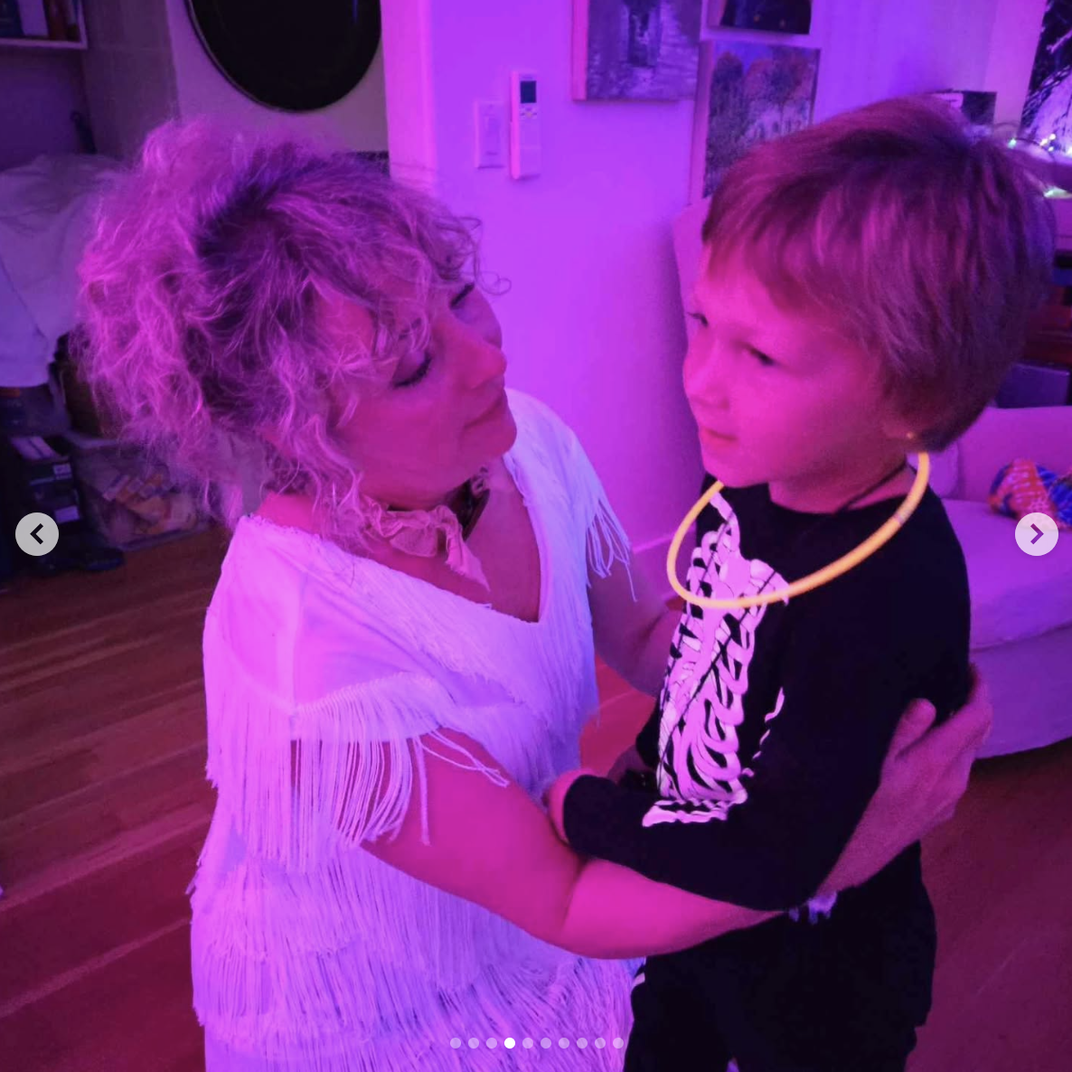 Jen Darbellay is pictured with one of her kids during a Halloween party, dated April 30, 2025 | Source: Instagram/heather_dot_oh