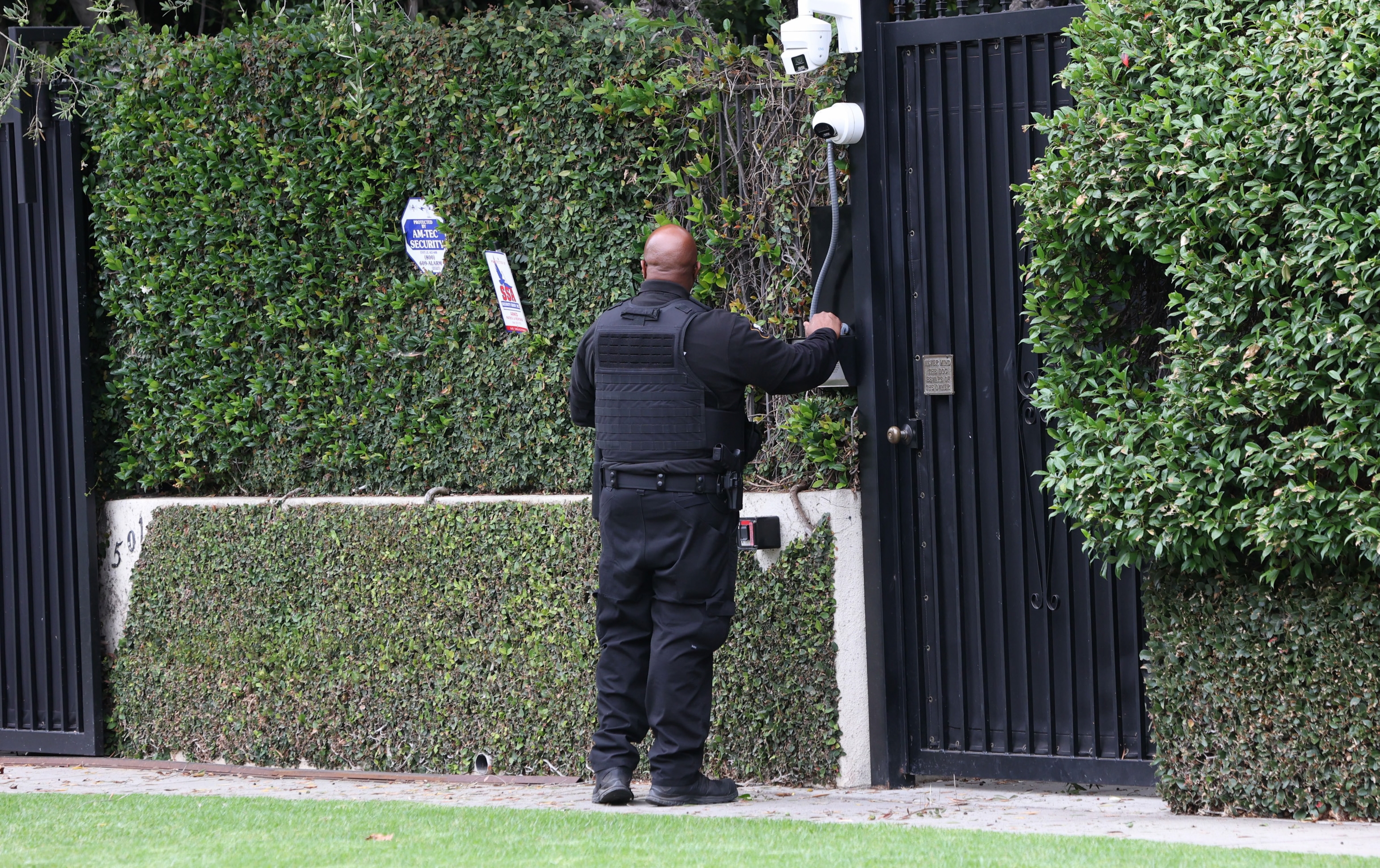 A security guard outside Ozzy Osbourne's Los Angeles home on July 22, 2025, in California. | Source: Getty Images