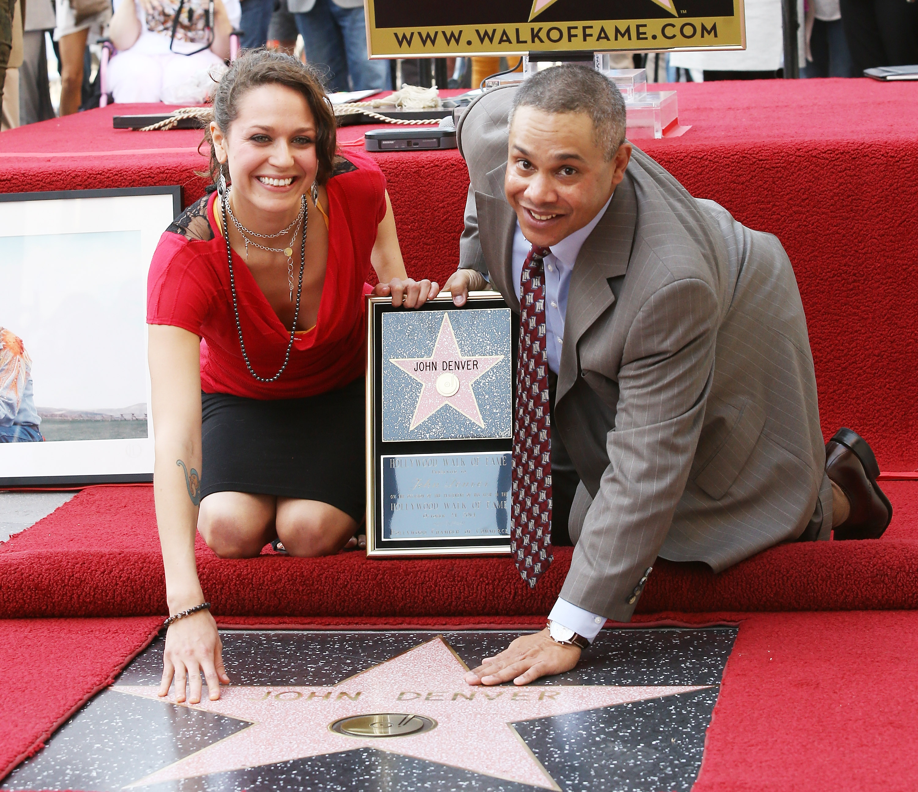 Jesse Belle Deutschendorf and Zachary John Denver, John Denver's children attend the ceremony honoring their father, John Denver with a Star on The Hollywood Walk of Fame held on October 24, 2014, in Hollywood, California. | Source: Getty Images