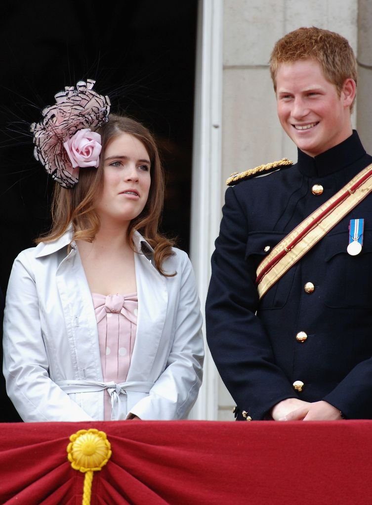 Princess Eugenie and Prince Harry together on a balcony during The Queen's Birthday Parade and Trooping The Colour at Buckingham Palace on June 17, 2006 in London, England. | Source: Getty Images