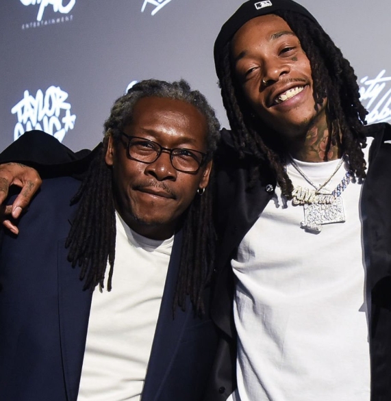 Wiz Khalifa and his father, Laurence Thomaz, pose together in a photo shared on February 14, 2026. | Source: X/STAYGROUNDEAD TV