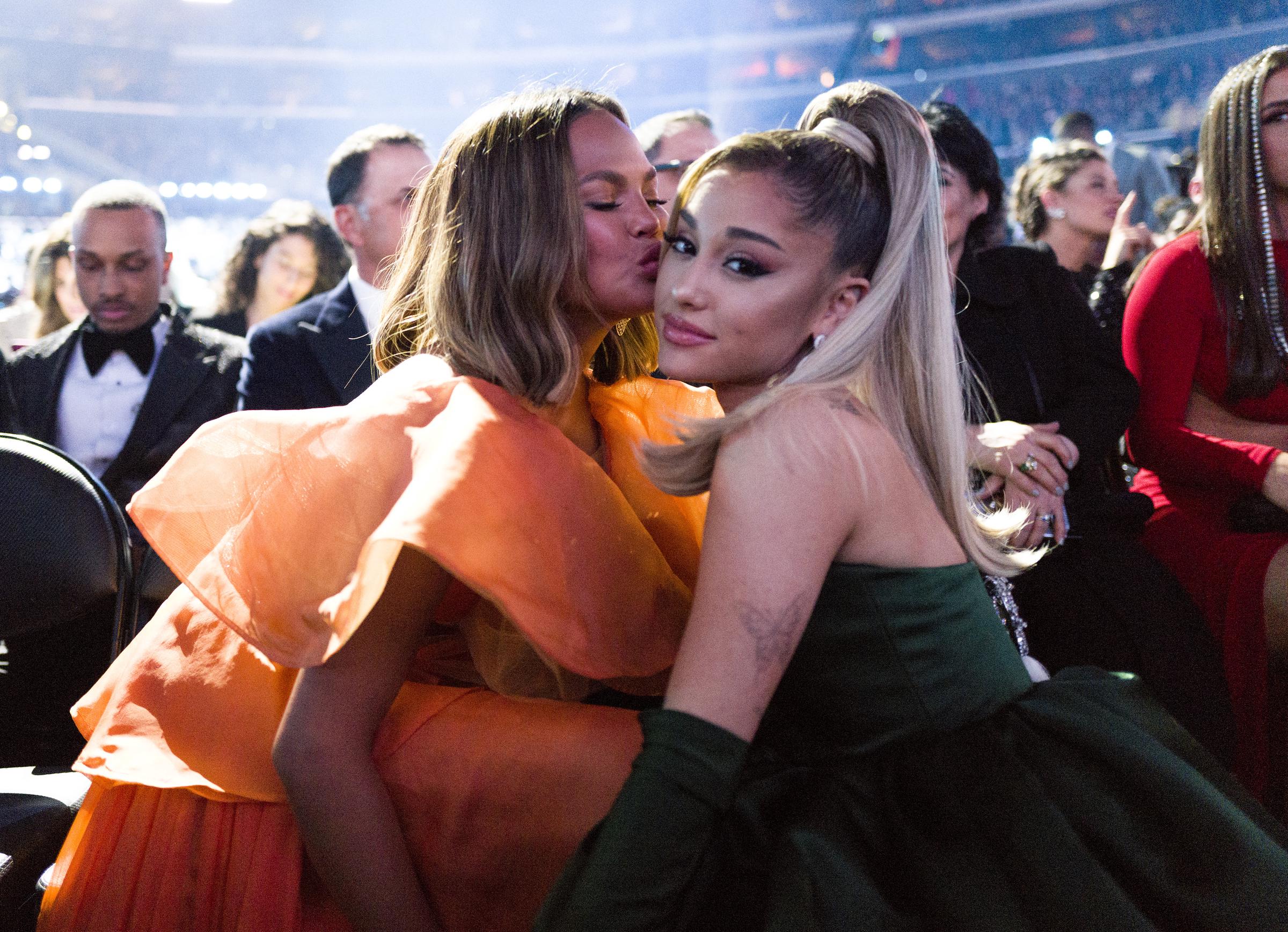 Chrissy Teigen and Ariana Grande attend the 62nd Annual Grammy Awards in California | Source: Getty Images