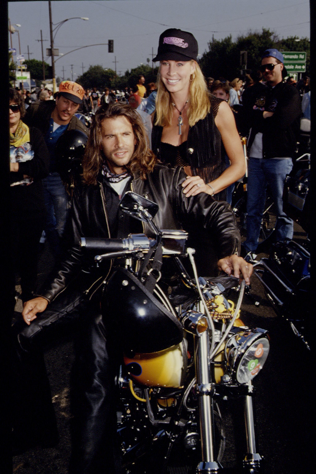 The actor and Kathleen Kinmont participate in the annual "Love Ride" of Harley-Davidson motorcycles on November 8, 1992, in Glendale.