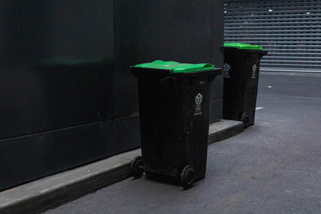 Trash cans in a garage | Source: Unsplash