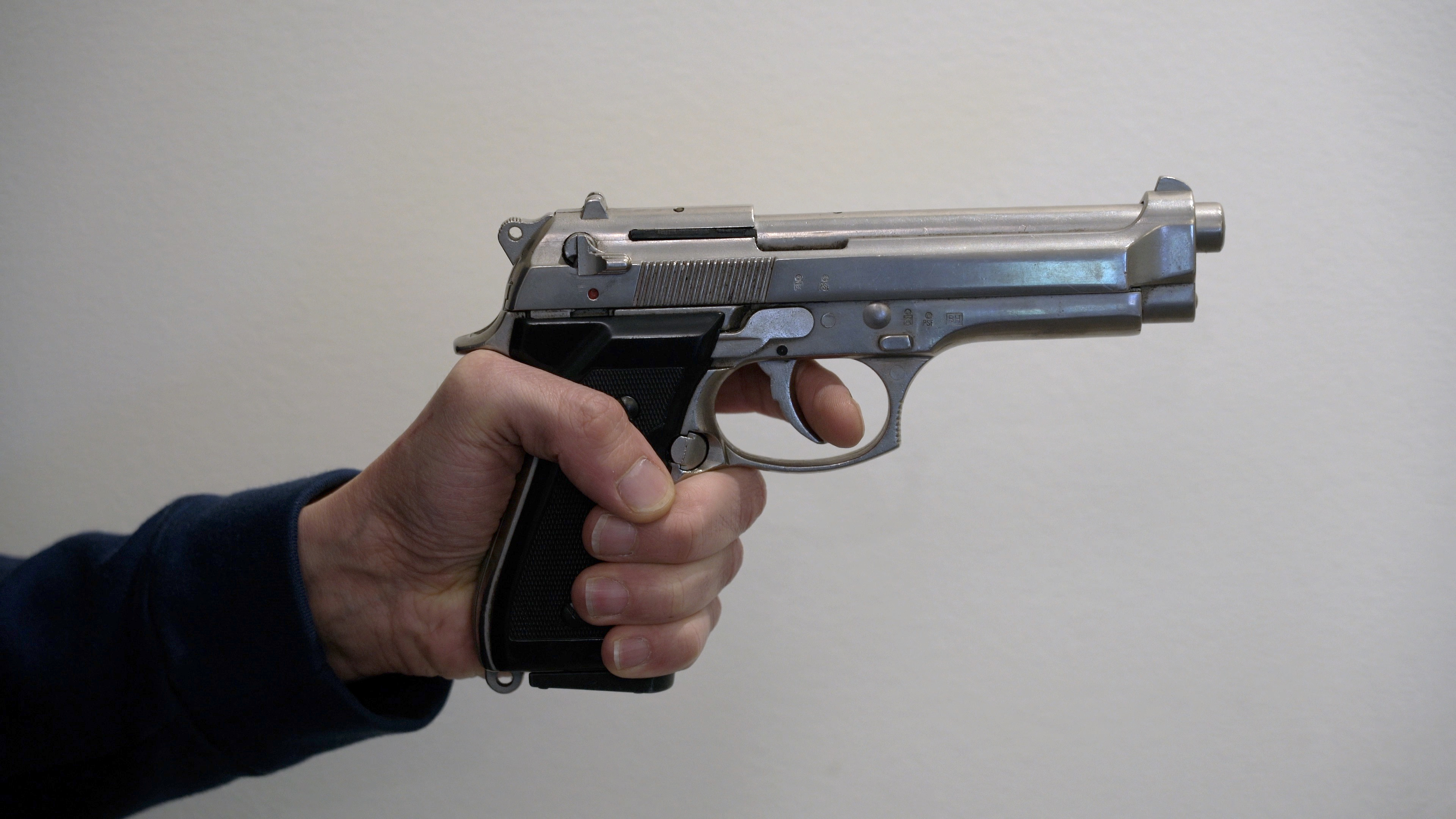 Revolver in hand | Source: Shutterstock