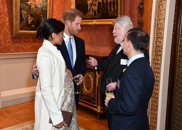 Meghan, Duchess of Sussex and Prince Harry, Duke of Sussex attend a reception to mark the fiftieth anniversary of the investiture of the Prince of Wales at Buckingham Palace | Photo: Getty Images