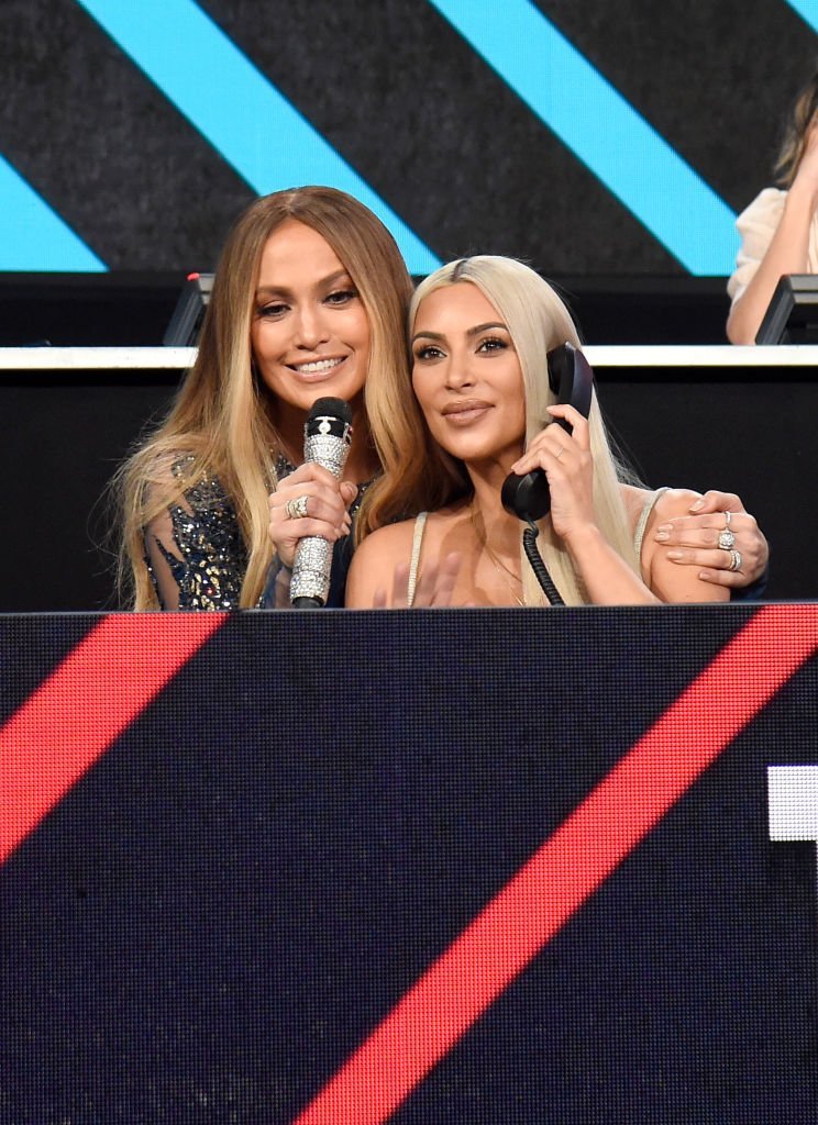 Jennifer Lopez and Kim Kardashian participate in the phone bank onstage during "One Voice: Somos Live! A Concert For Disaster Relief" on October 14, 2017, in Los Angeles, California. | Source: Getty Images.