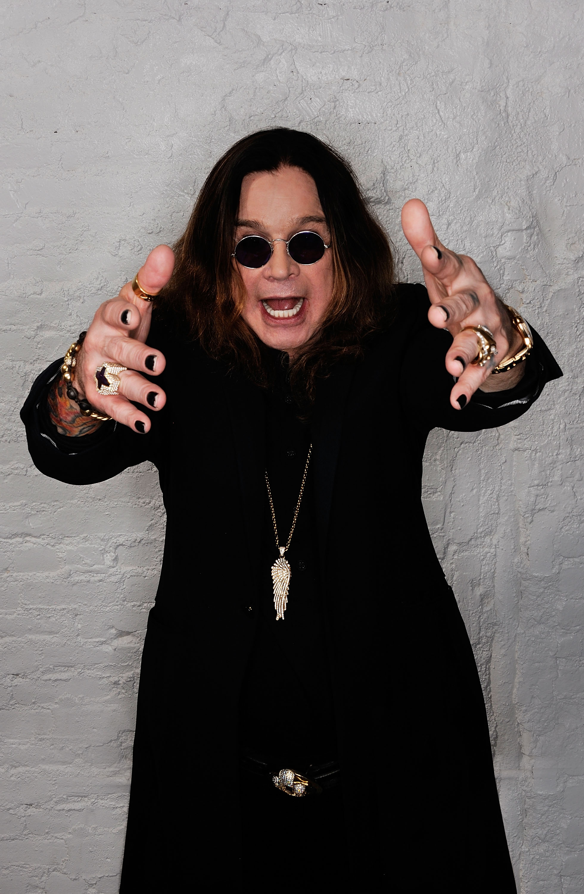 Ozzy Osbourne poses with his arms outstretched during a portrait session at the 2011 Tribeca Film Festival in New York City. The heavy metal icon died in July 2025 at age 76, leaving behind a legacy that continues to be celebrated by his family and fans. | Source: Getty Images