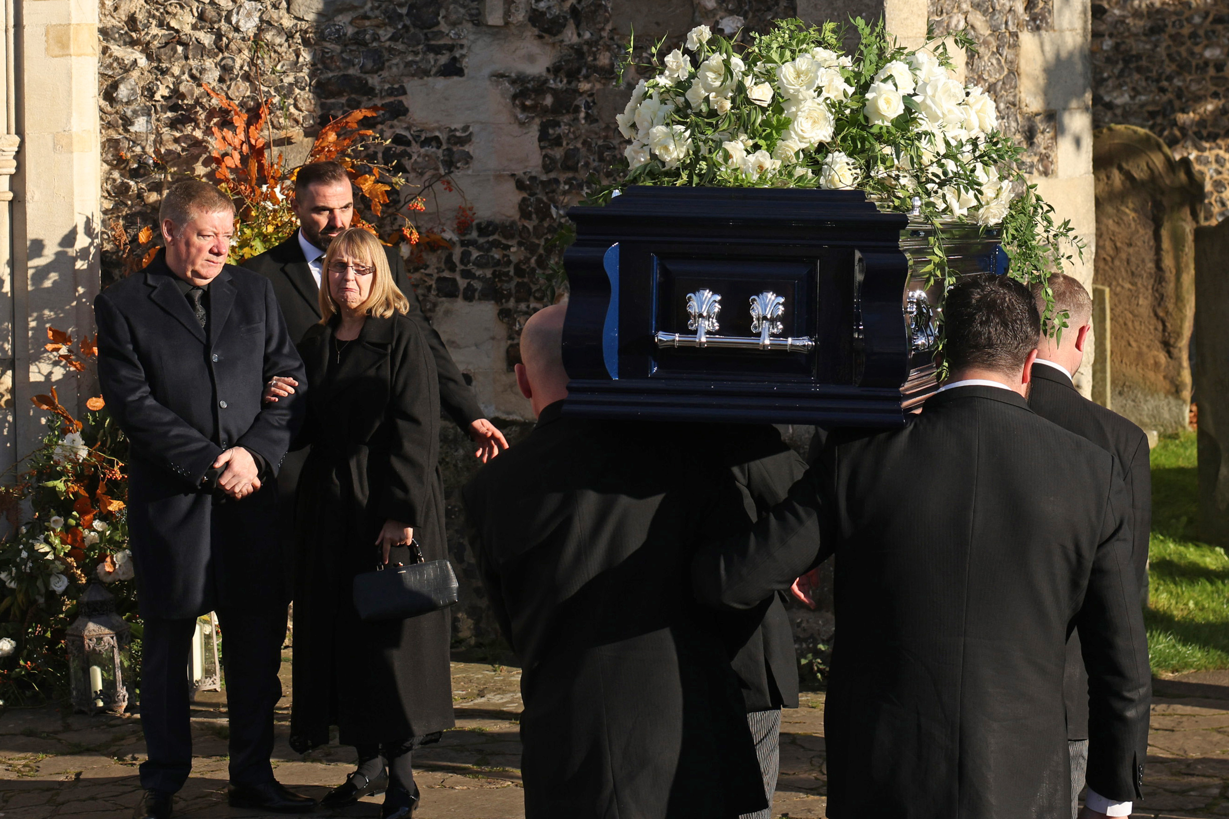 Karen and Geoff Payne watch as Liam Payne's coffin is carried into the funeral on November 20, 2024 in Amersham, England. | Source: Getty Images