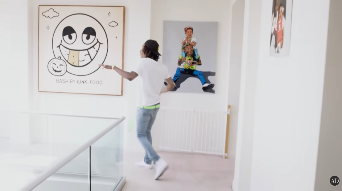 Artwork and family-inspired pieces are displayed throughout Wiz Khalifa's Los Angeles home. | Source: YouTube/Architectural Digest