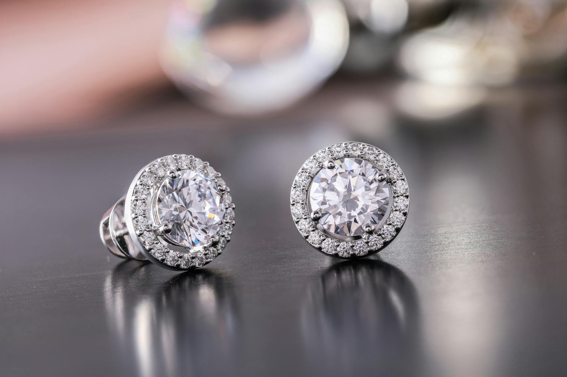 A close-up shot of silver diamond stud earrings | Source: Pexels