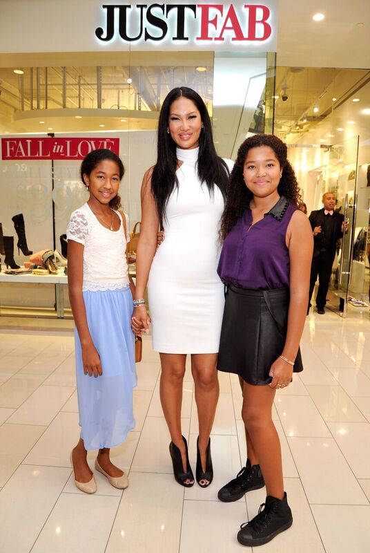 Kimora, Aoki, and Ming Lee Simmons at a fashion event years ago. | Source: Getty Images / GlobalImagesUkraine