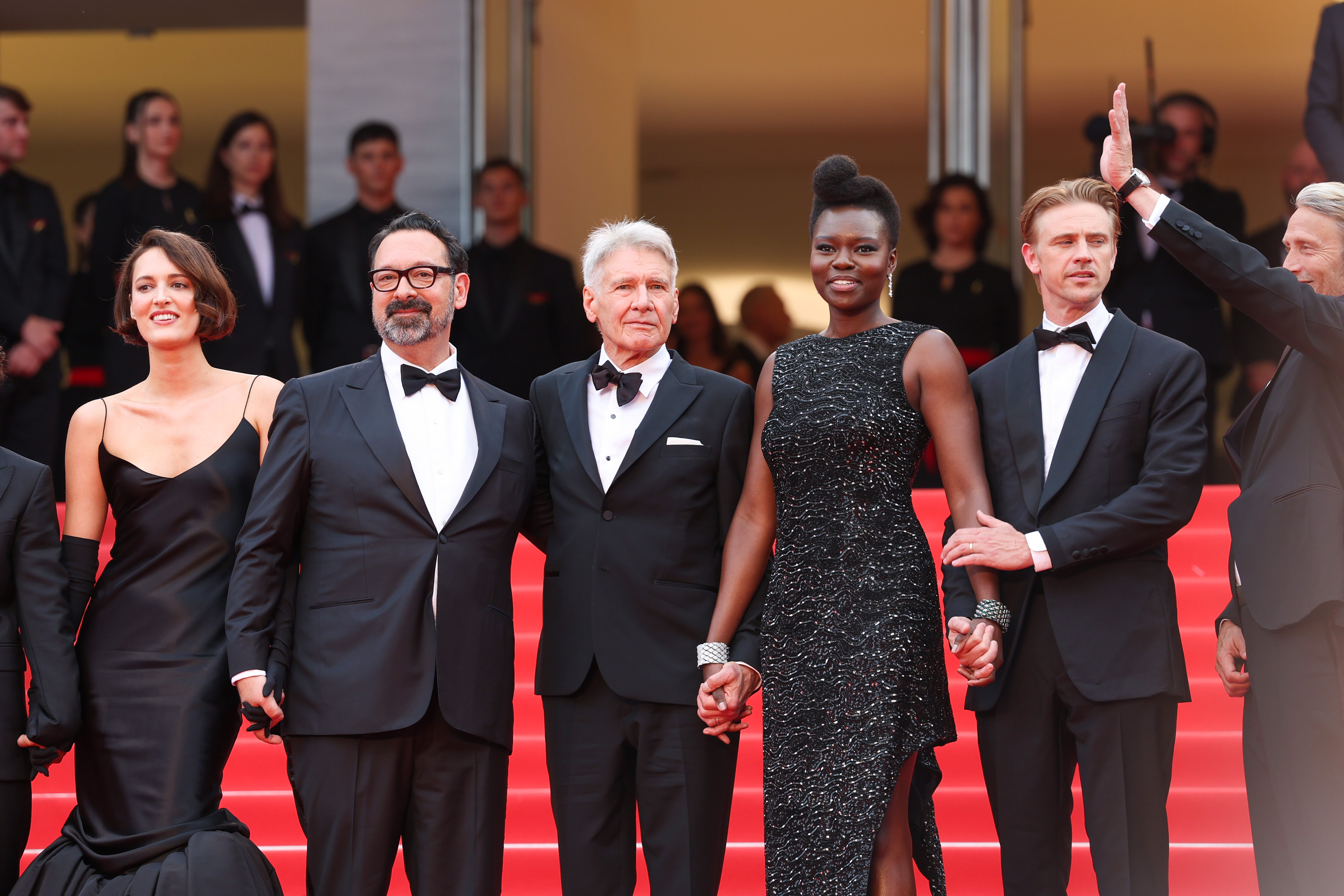 L-R) Phoebe Waller-Bridge, Director James Mangold, Harrison Ford, Shaunette Renée Wilson, Boyd Holbrook and Mads Mikkelsen attend the "Indiana Jones And The Dial Of Destiny" red carpet at Palais des Festivals on May 18, 2023, in Cannes, France. | Source: Getty Images