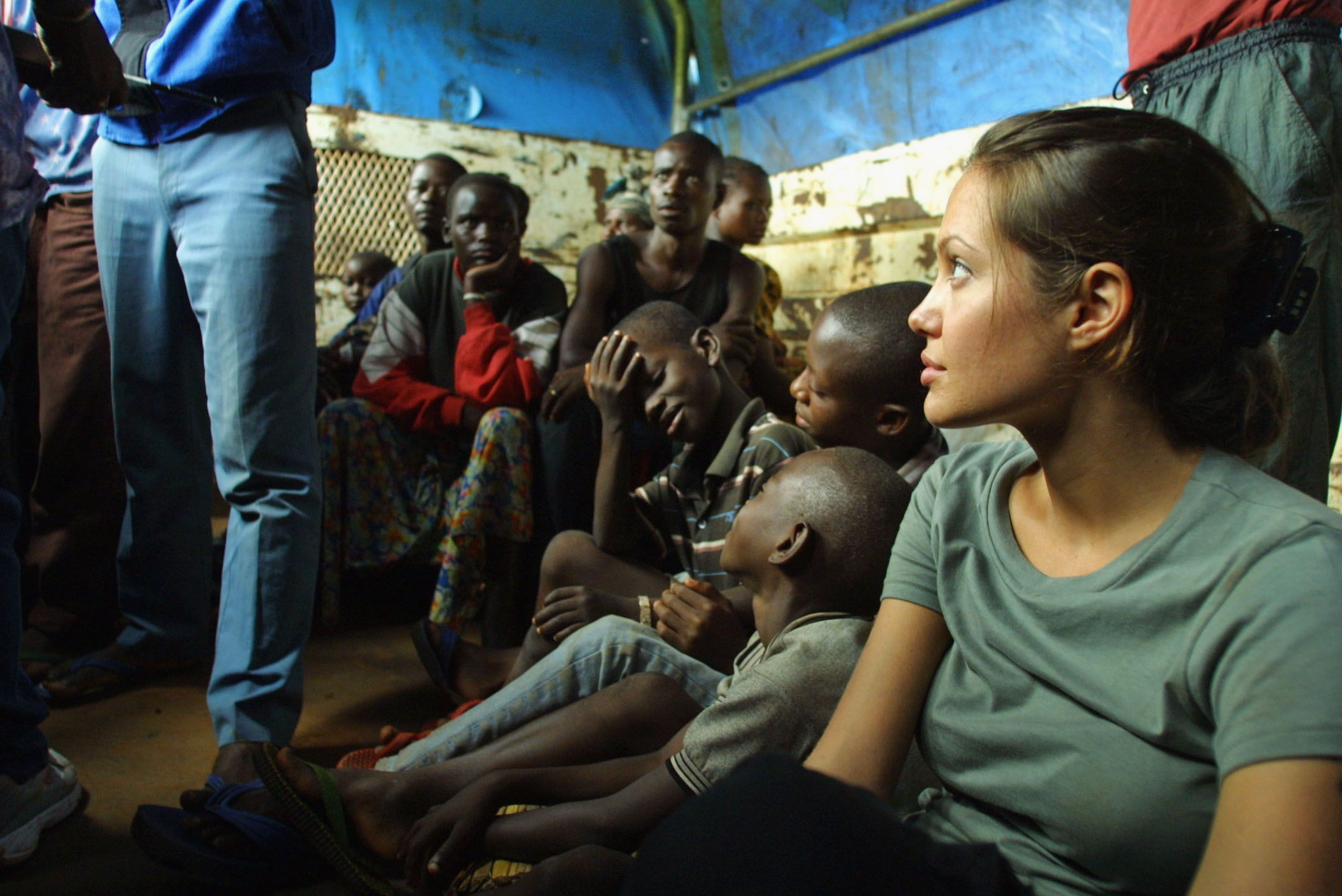UNHCR Goodwill Ambassador Angelina Jolie on a truck with refugees en route from Kigoma to Lugufu Camp, Tanzania in 2003 | Source: Getty Images