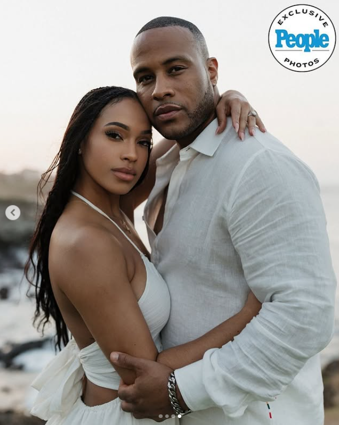 The couple stands by the ocean, with DeVon Franklin holding Maria Castillo close as she rests her hand on his chest | Source: Instagram/people