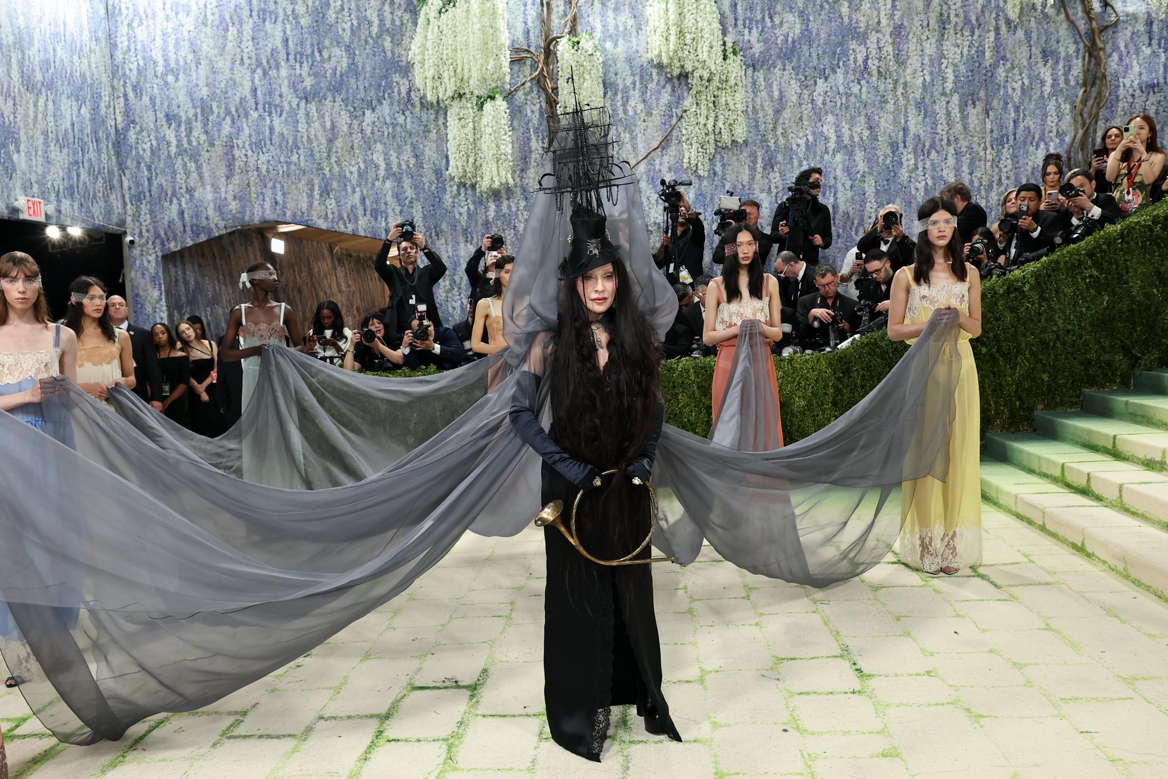 Madonna arrives with a dramatic, performance-style presentation | Source: Getty Images