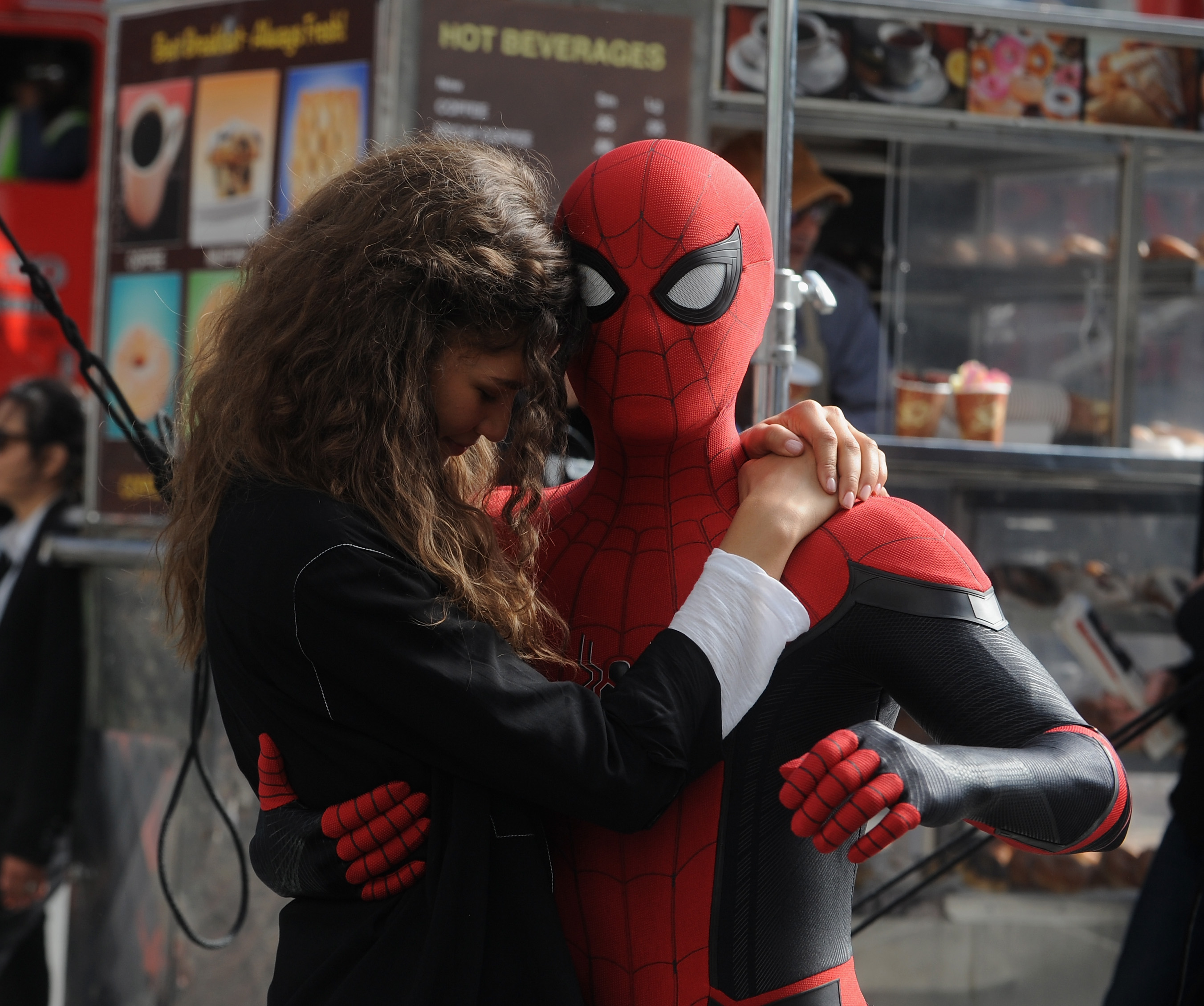 Caught between takes on the "Spider-Man: Far From Home" set in New York City on 12 October 2018, Tom — fully suited as the web-slinger — pulled Zendaya into a quiet, intimate hug. Her head rested tenderly against his as he wrapped a protective arm around her — a touching behind-the-scenes moment that blurred the line between reel and real.