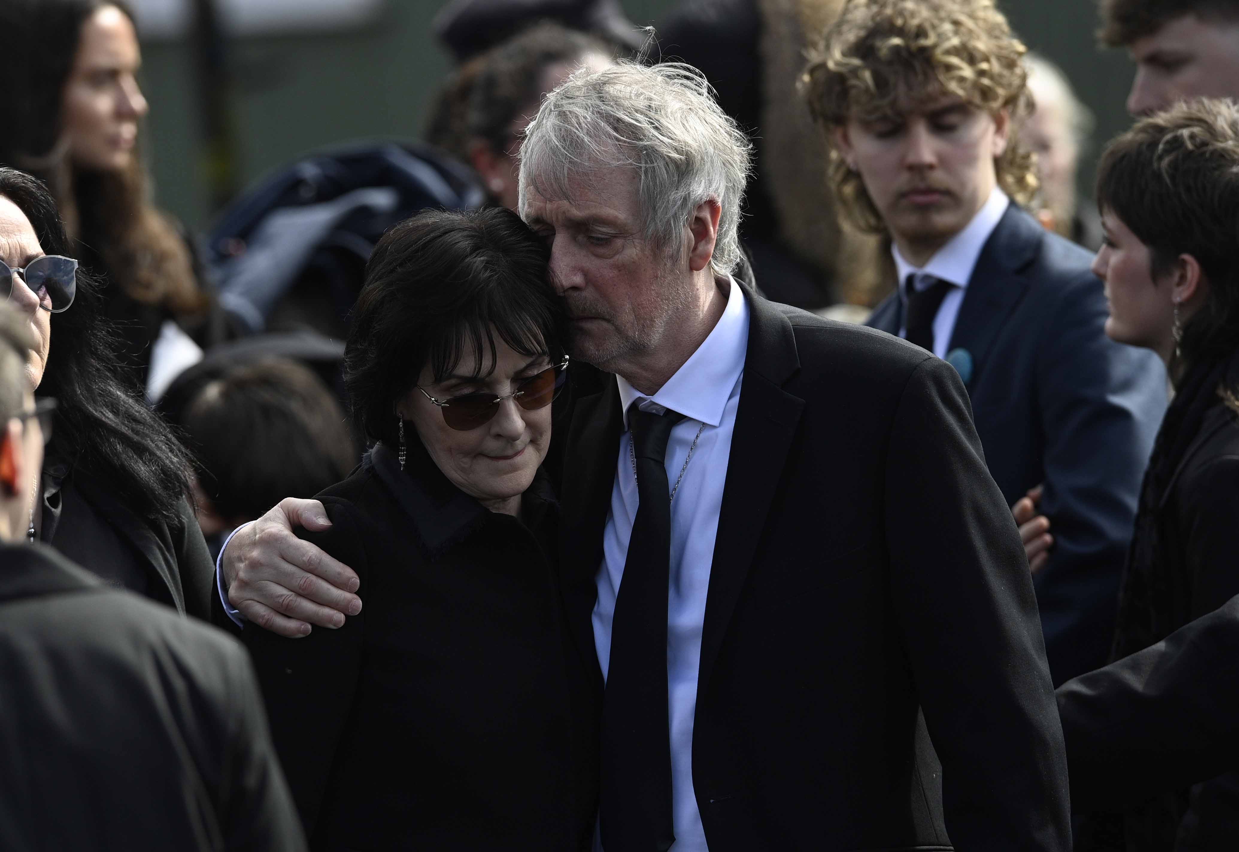 Moya Brennan's sister Enya and brother Pól Brennan during her funeral at St Patrick's Church on 17 April 2026 in Donegal, Ireland. | Source: Getty Images