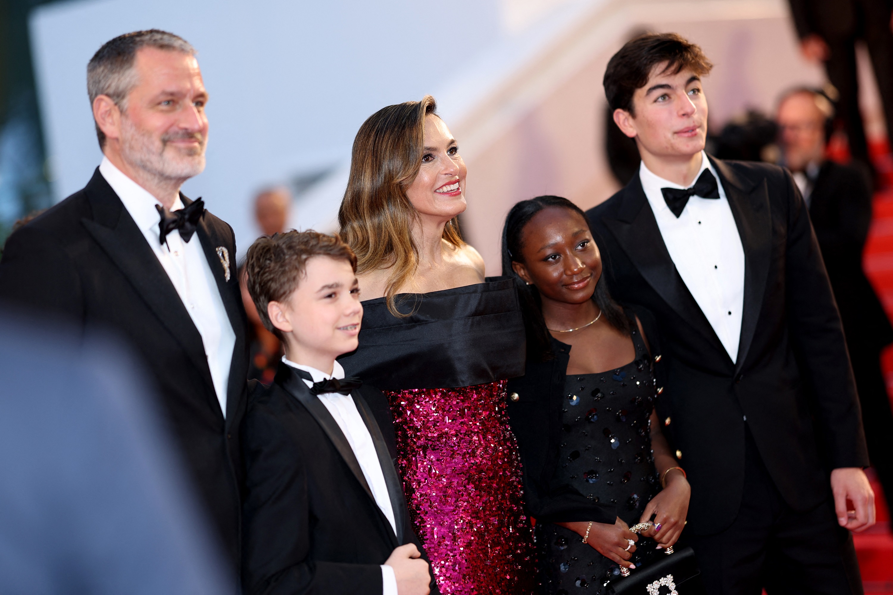 The whole family beams on the red carpet, gathered close with warm, joyful expressions. Mariska stands at the center, glowing as Peter, Andrew, Amaya, and August surround her, all dressed to the nines and radiating pride and happiness.