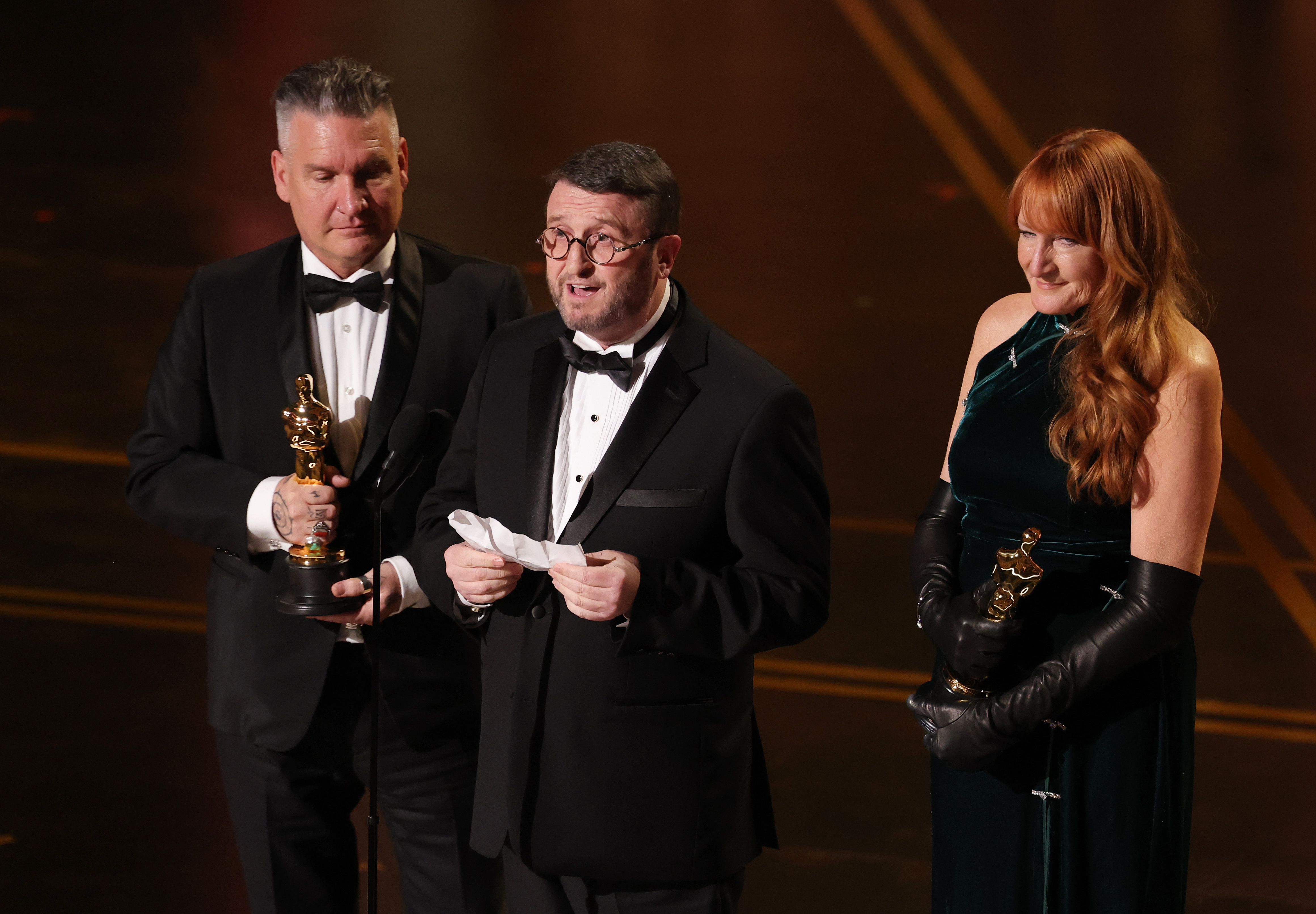 (L-R) Jordan Samuel, Mike Hill, and Cliona Furey accept the Makeup and Hairstyling award for "Frankenstein" onstage during the 98th Oscars at Dolby Theatre on 15 March 2026 in Hollywood, California. | Source: Getty Images